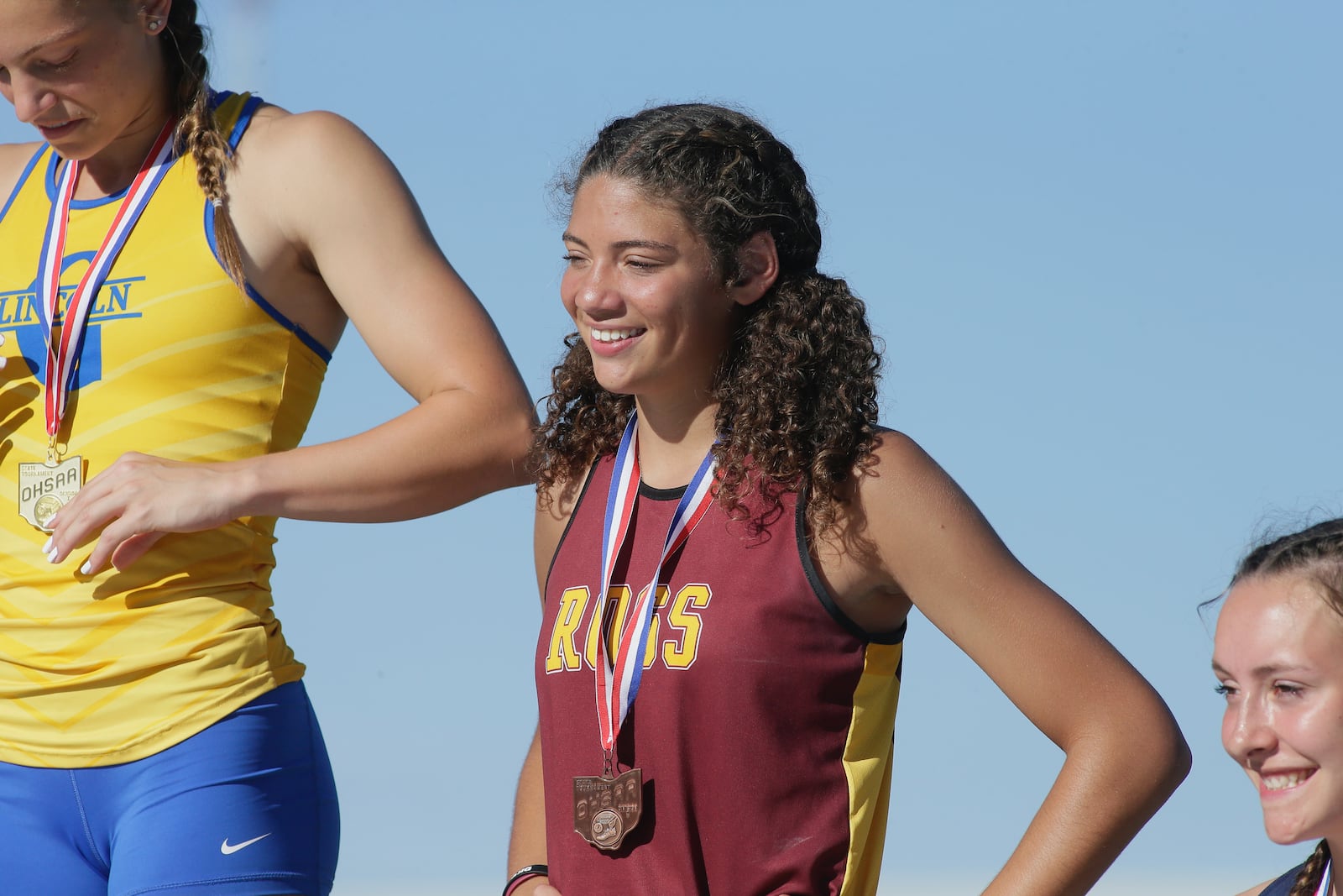 Myah Boze, of Ross, stands on the podium after placing in the Division I state track championship on Saturday, June 4, 2022, at Jesse Owens Memorial Stadium in Columbus. David Jablonski/Staff