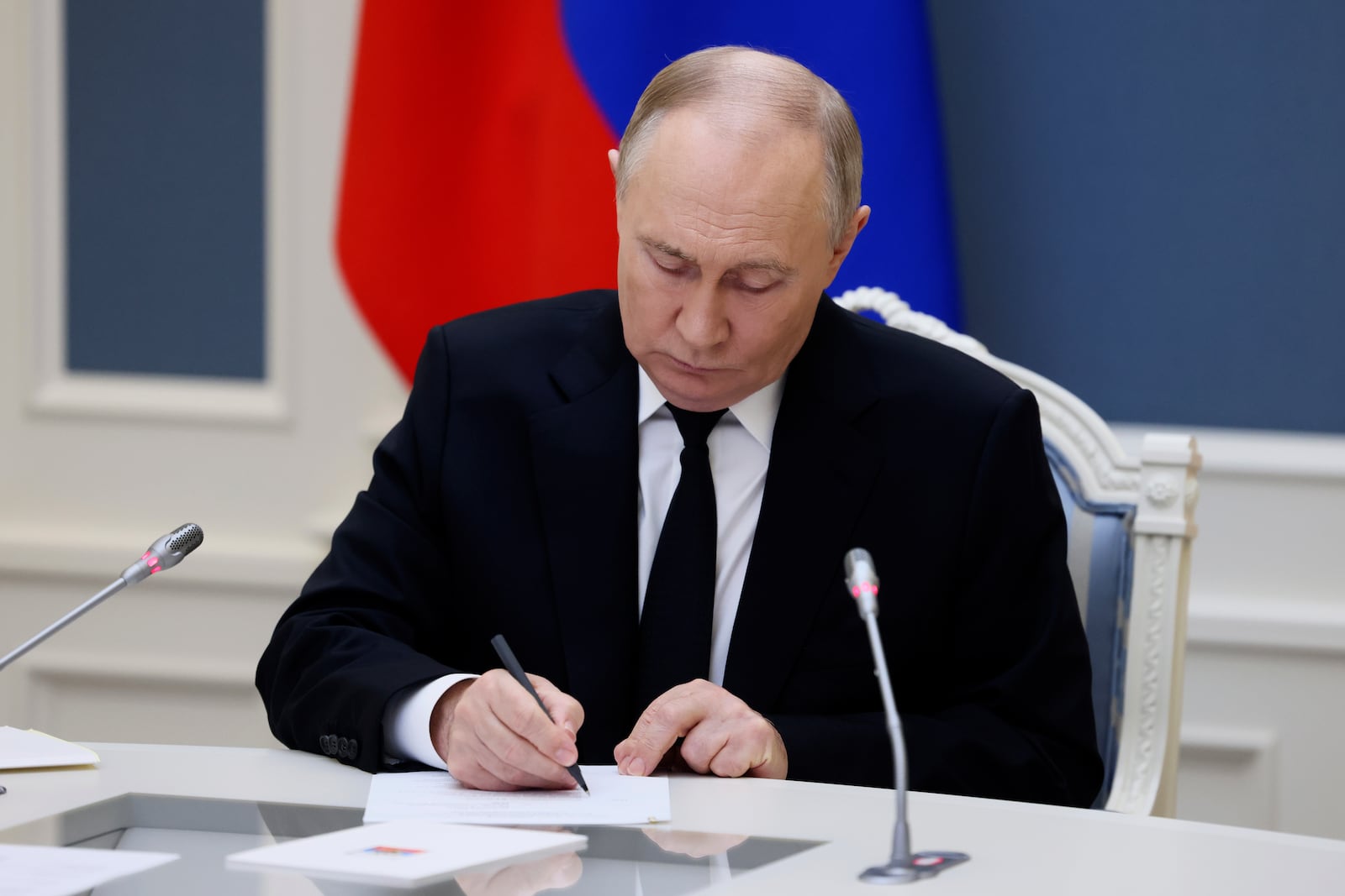 Russian President Vladimir Putin takes part in an exercise of Russia's strategic nuclear deterrence forces to train actions of officials on operating nuclear weapons with practical launches of ballistic and cruise missiles, at the Kremlin in Moscow, Russia, Tuesday, Oct. 29, 2024. (Mikhail Metzel, Sputnik, Kremlin Pool Photo via AP)