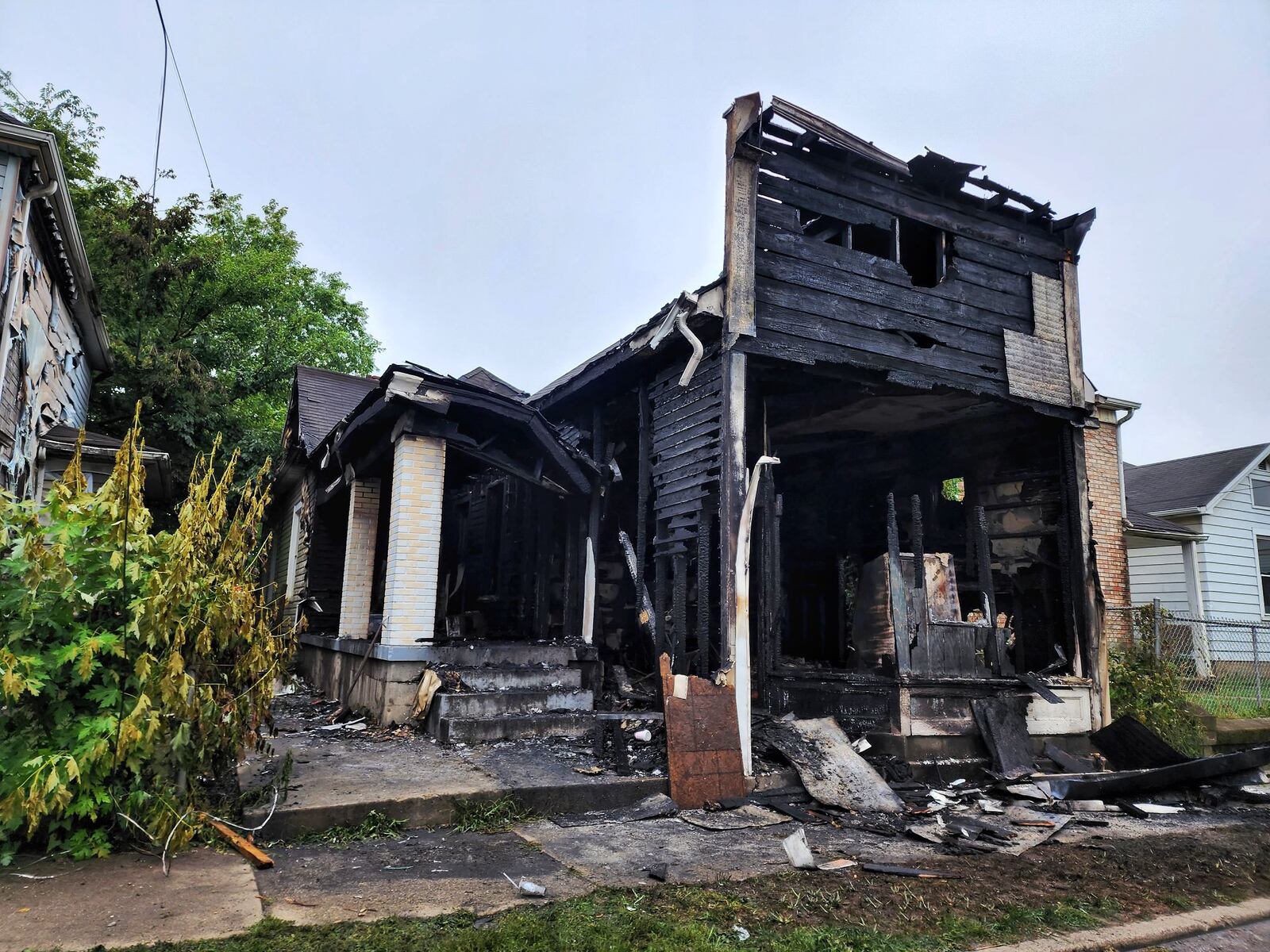 This house in the 1700 block of Manchester Avenue was severely damaged by a fire Sunday night. The only resident and Middletown firefighters were not injured, officials said. NICK GRAHAM/STAFF