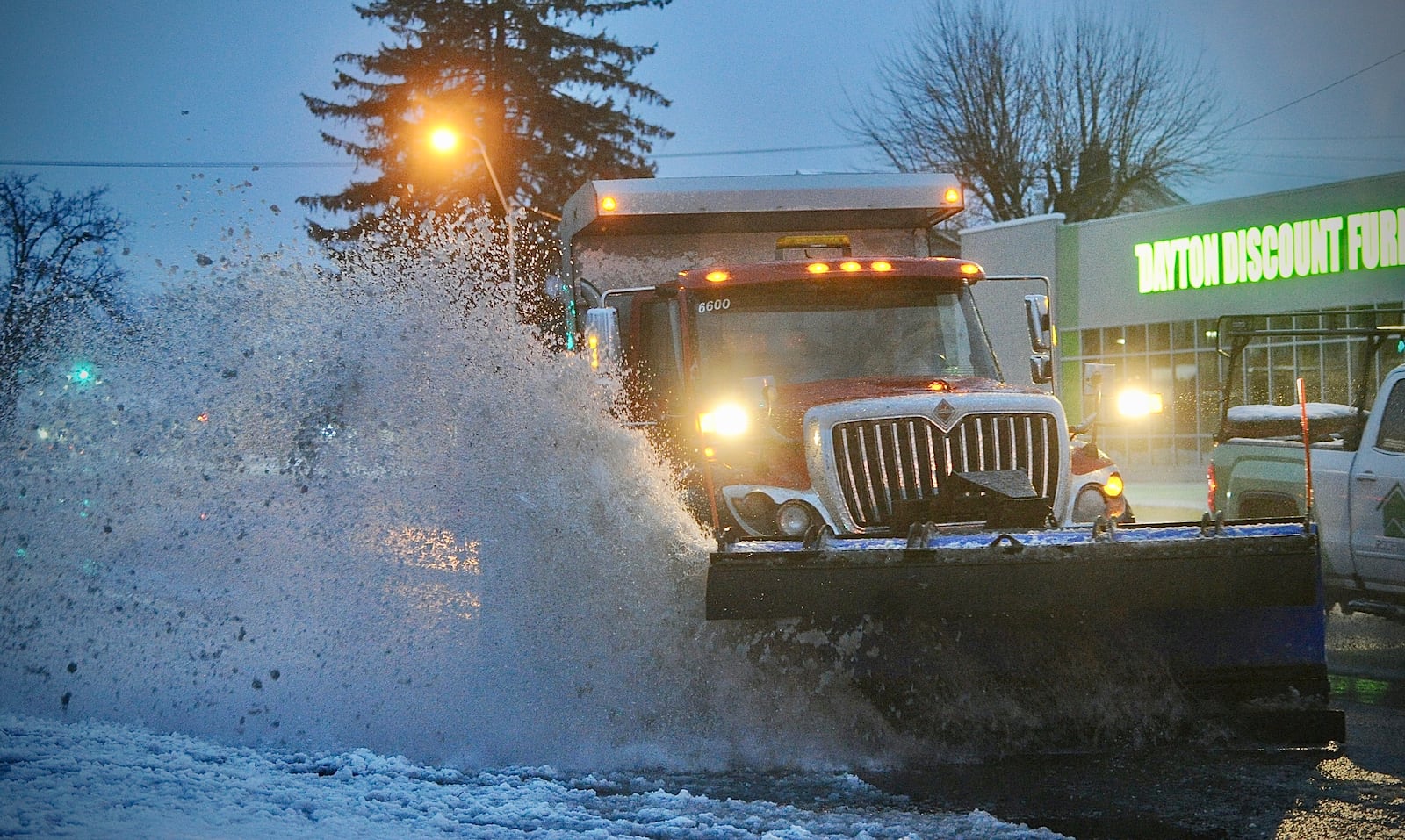 A city of Fairborn snow plow on Central Avenue in Fairborn early Wednesday morning, January 25, 2023. MARSHALL GORBY \STAFF