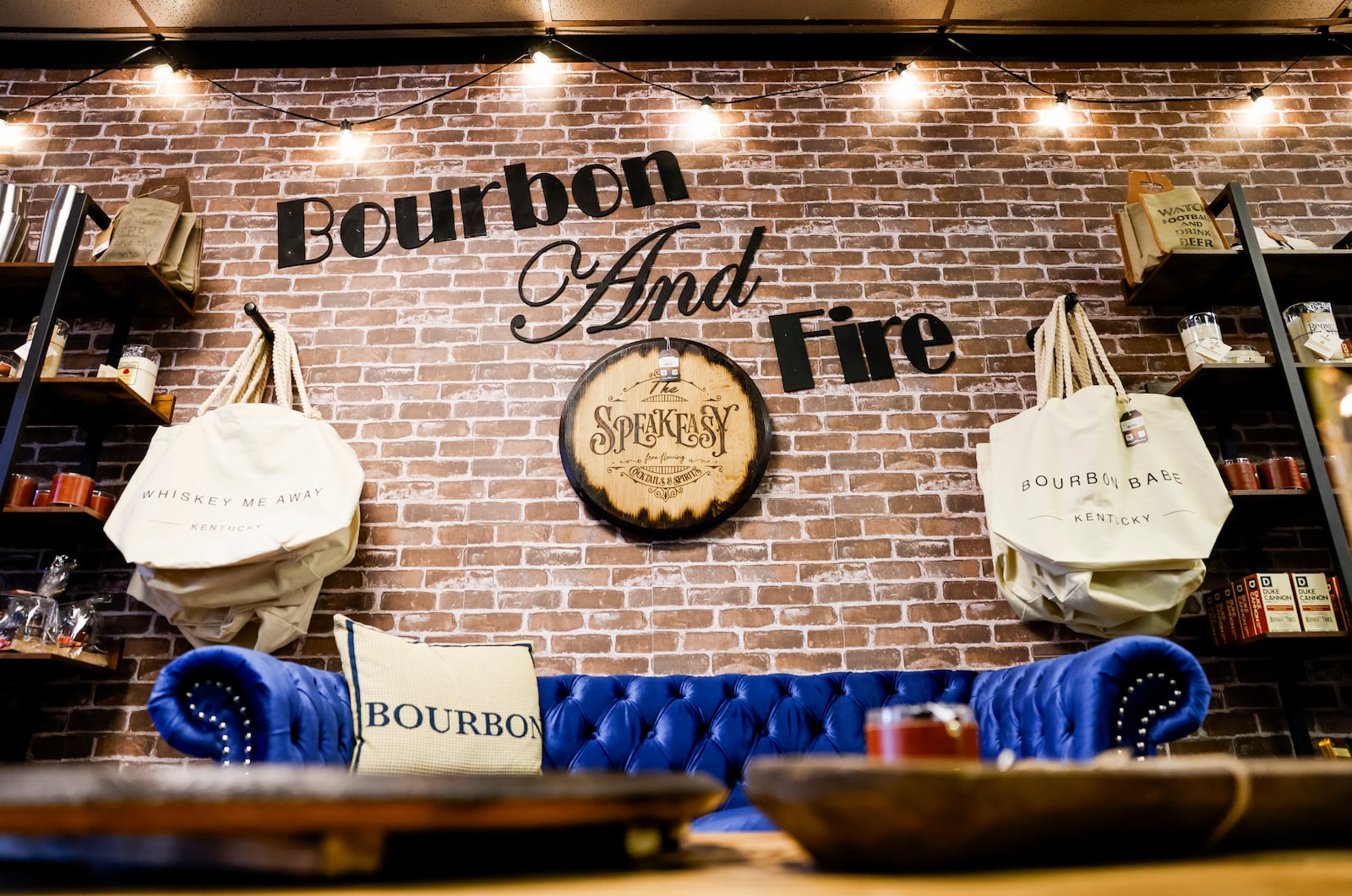 Bourbon and Fire will open their new storefront Wednesday, June 28 on Main Street in Hamilton. The store features custom laser engraved bourbon barrel lid games and decor, mixers, cigars and more. The back of the shop has a curated clothing boutique. NICK GRAHAM/STAFF