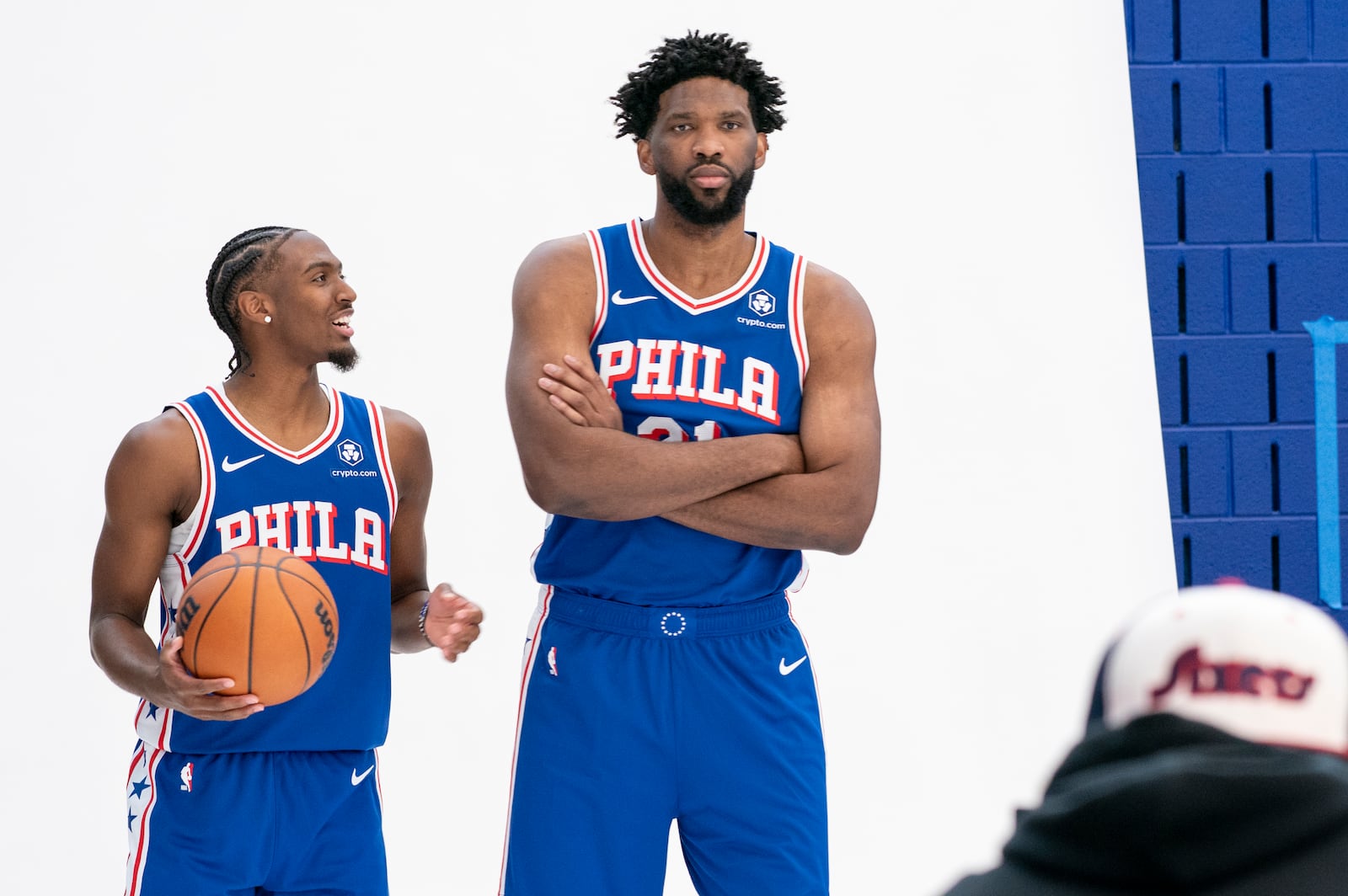 Philadelphia 76ers' Tyrese Maxey, left, reacts as he poses with Joel Embiid, right, for photos during the NBA basketball team's media day, Monday, Sept. 30, 2024, in Camden, N.J.. (AP Photo/Chris Szagola)