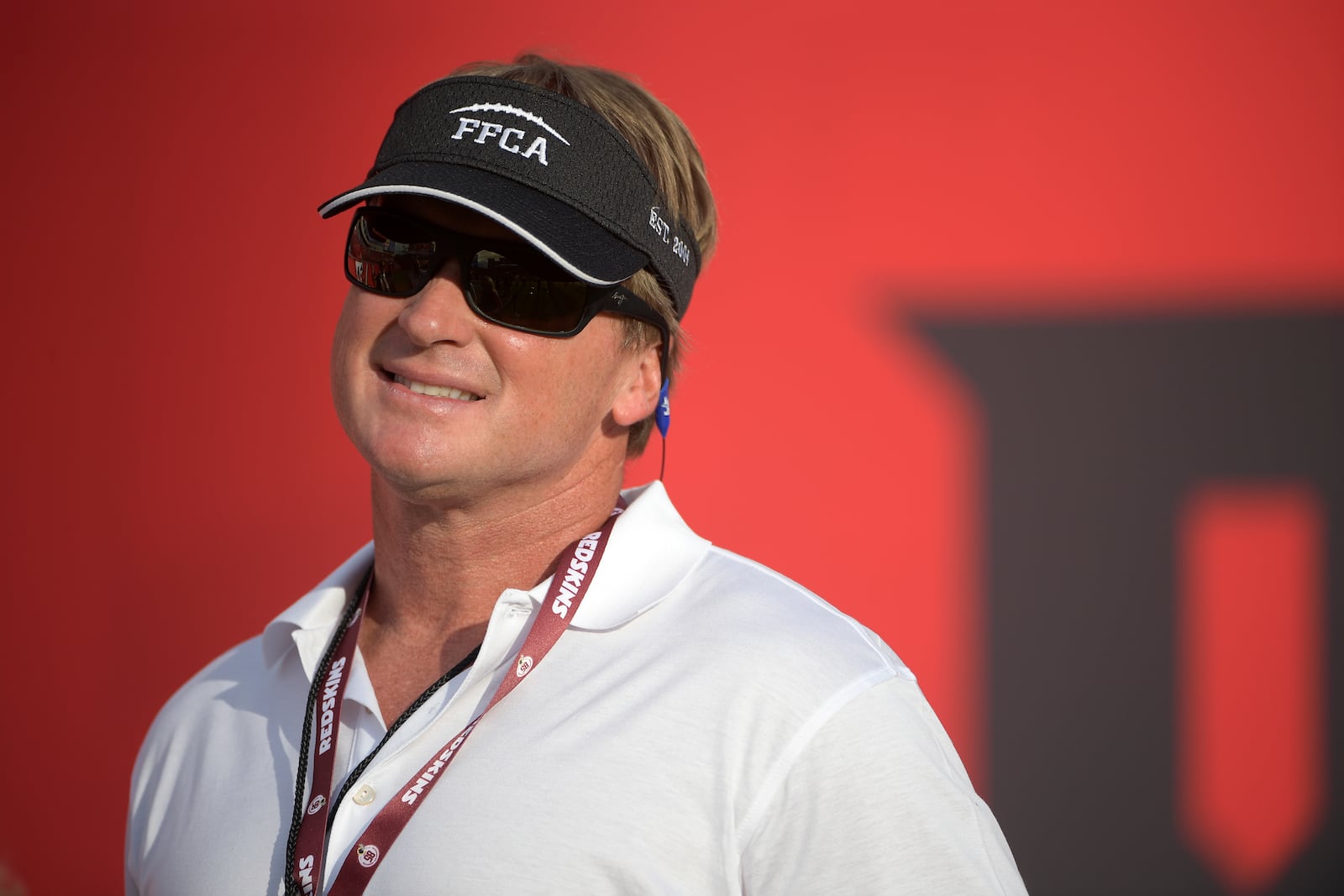 FILE - Jon Gruden watches warmups before an NFL preseason football game between the Tampa Bay Buccaneers and the Washington Redskins Thursday, Aug. 31, 2017, in Tampa, Fla. (AP Photo/Phelan M. Ebenhack,File)