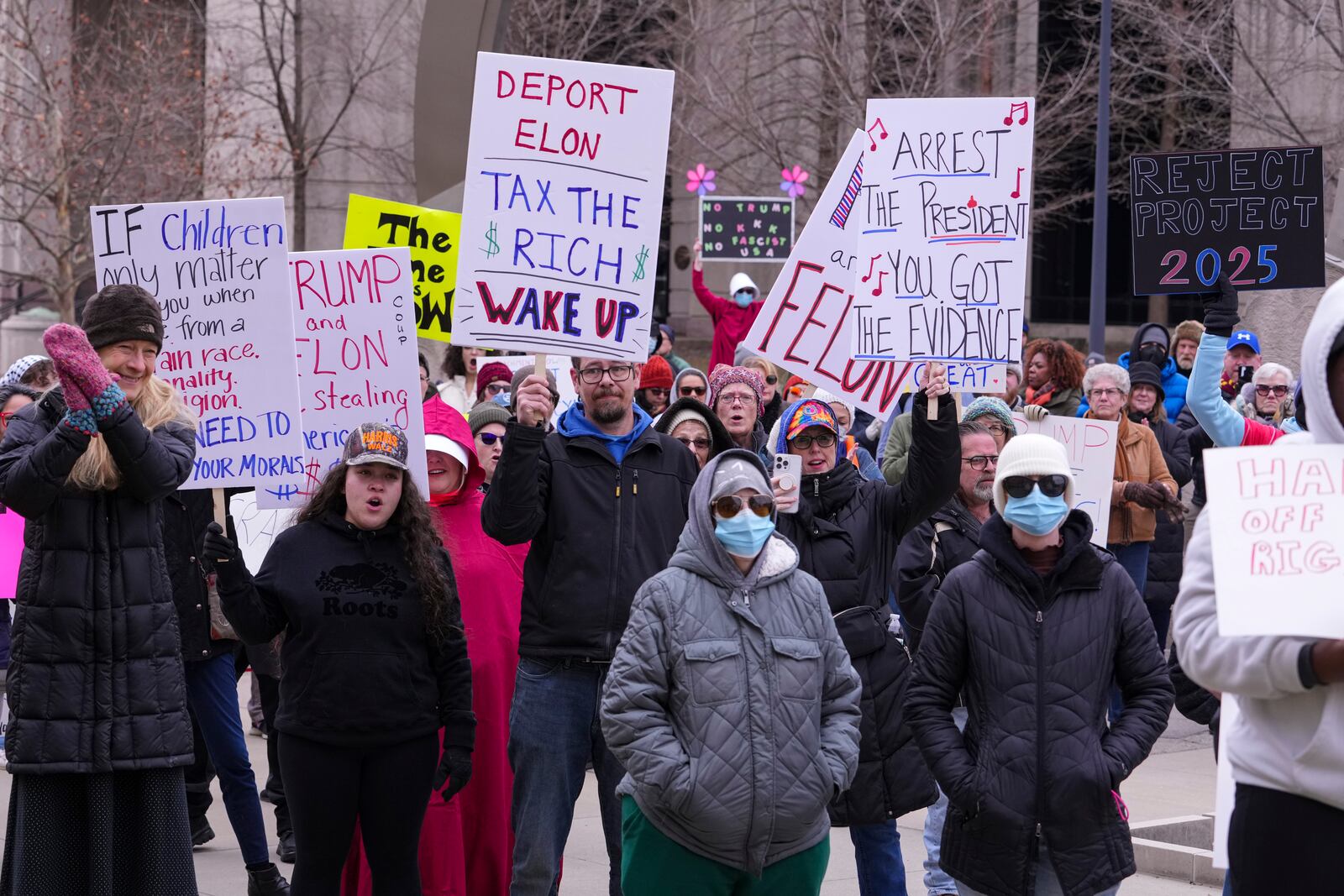 Protestors gather for a rally against Project 2025 at the Statehouse in Indianapolis, Wednesday, Feb. 5, 2025. (AP Photo/Michael Conroy)