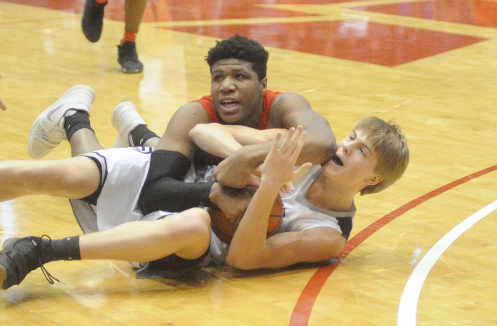 Lakota East’s Grant Spicer (bottom) calls a timeout with Princeton’s Gabe O’Neal on top of him during Saturday afternoon’s Division I district final at the University of Dayton Arena. MARC PENDLETON/STAFF