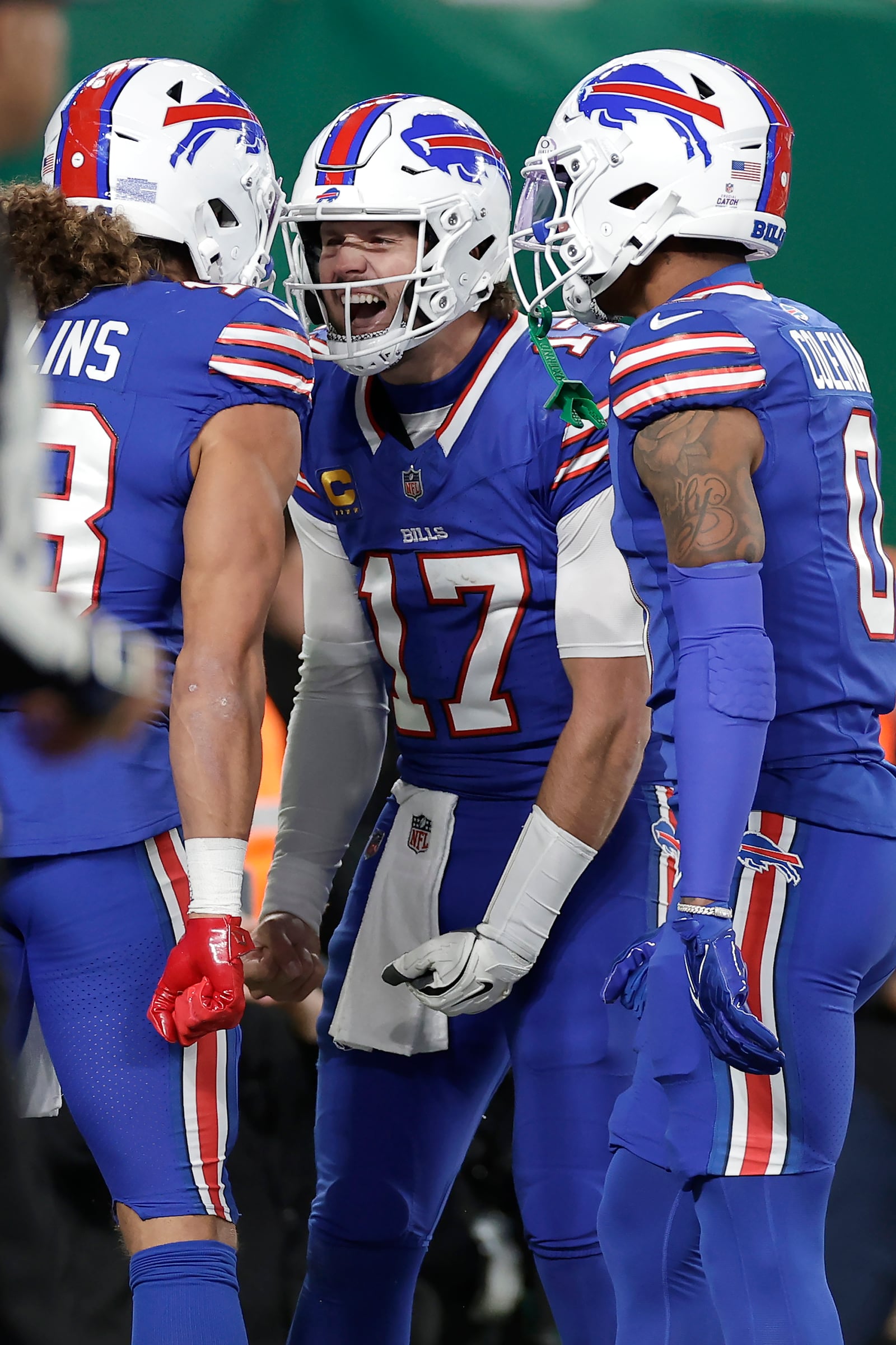 Buffalo Bills wide receiver Mack Hollins, left, celebrates with quarterback Josh Allen (17) and wide receiver Keon Coleman (0) after scoring against the New York Jets during the first half of an NFL football game in East Rutherford, N.J., Monday, Oct. 14, 2024. (AP Photo/Adam Hunger)