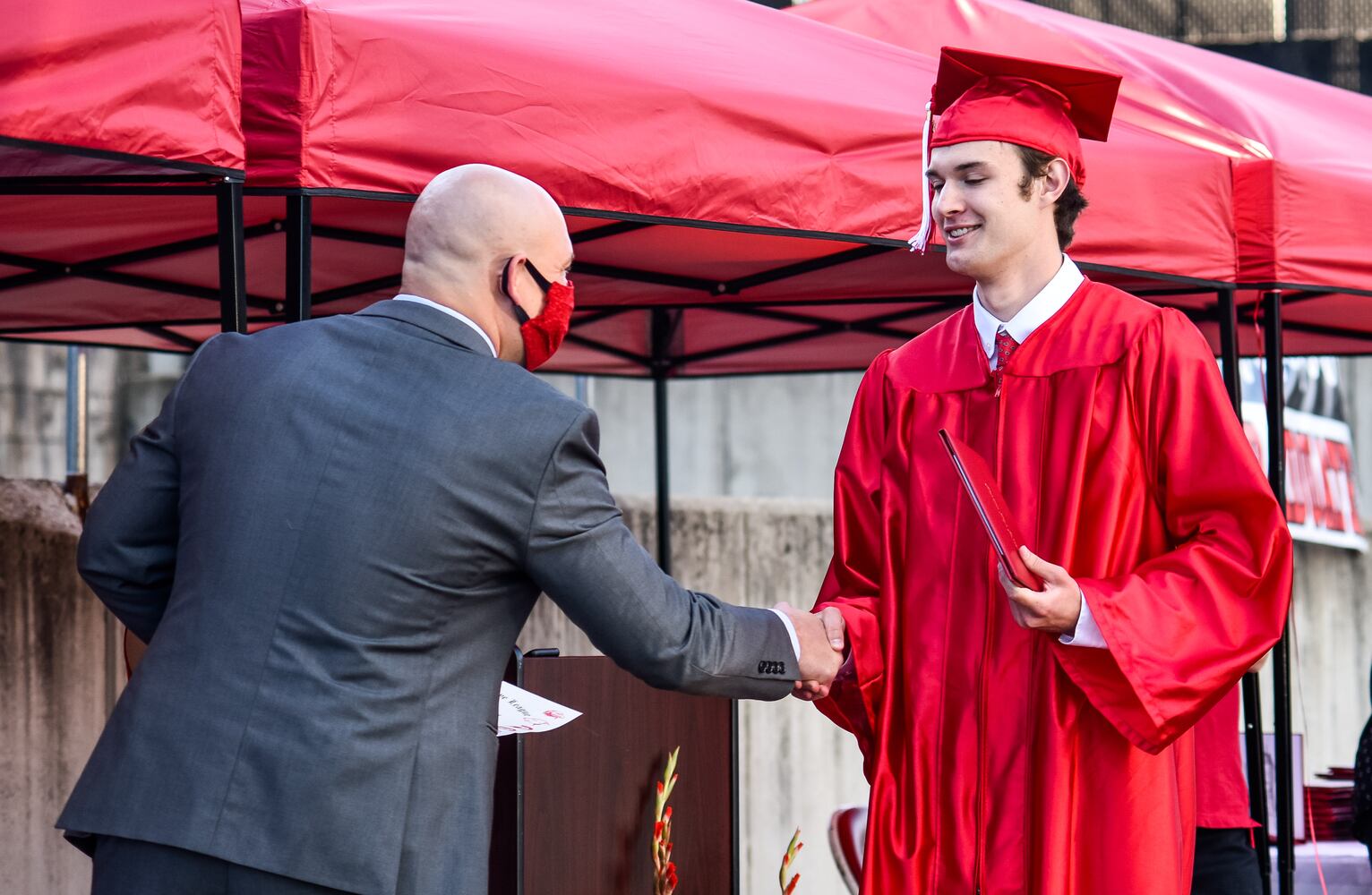 Madison High School drive-thru graduation ceremony at Land of Illusion