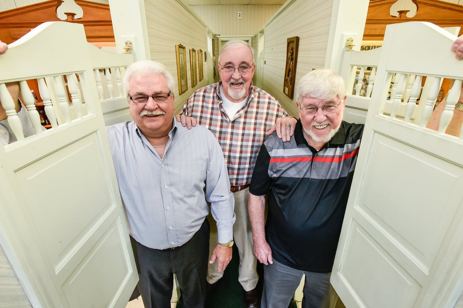 Pete Kurtz, Bob Youtsler, and Ishmael “Charlie” DeBord, L to R, stand in their barber shop on Jackson Lane Wednesday, Jan. 10 in Middletown. The three have worked together at Squire Barber Service in Middletown for 50 years. NICK GRAHAM/STAFF