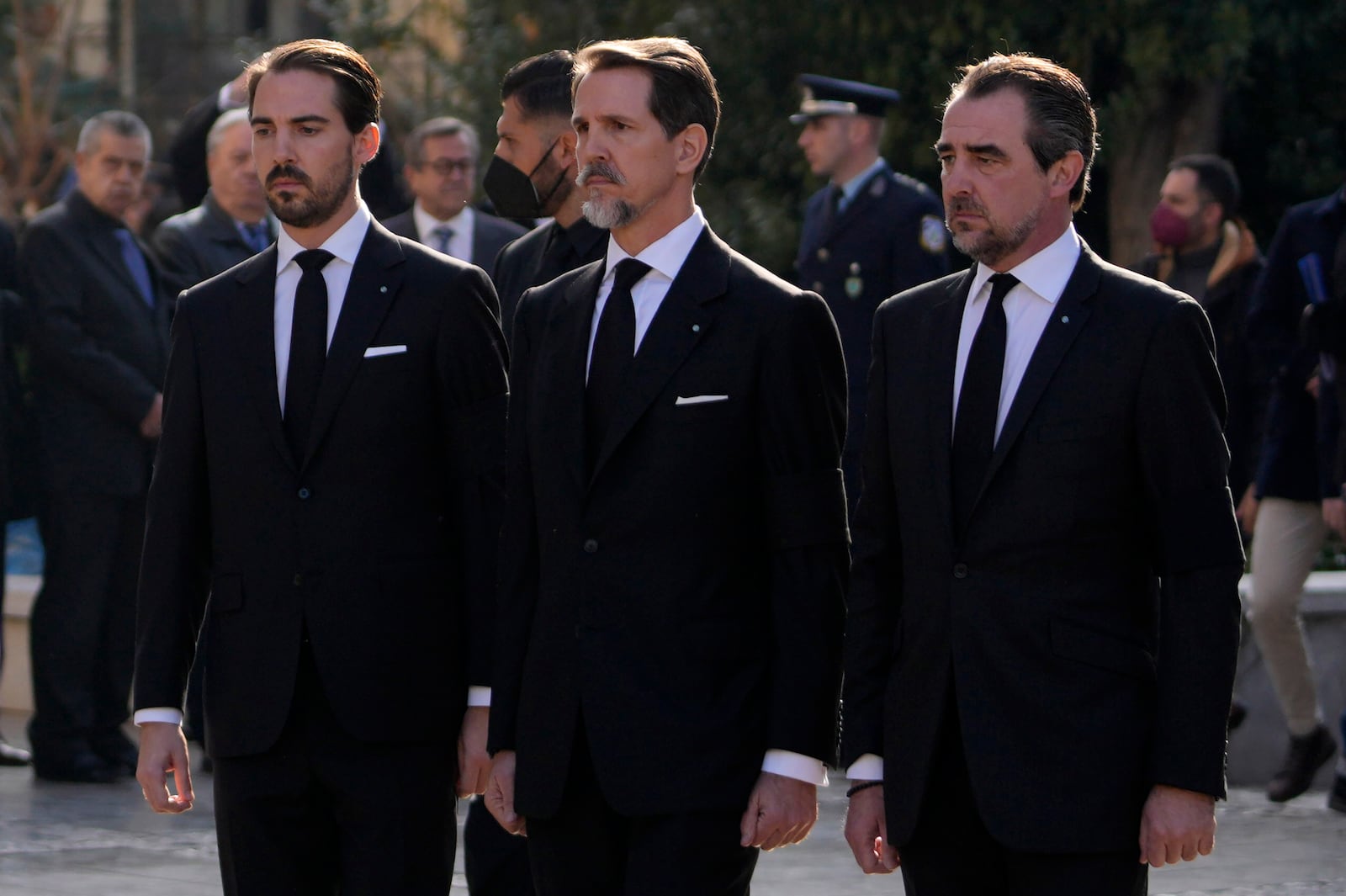 FILE - Prince Philippos, left, Prince Pavlos, center, and Prince Nikolaos, right, sons of former king of Greece Constantine II stand behind their father coffin as they arrive at the Metropolitan cathedral for his funeral in Athens, Monday, Jan. 16, 2023. (AP Photo/Petros Giannakouris, File)