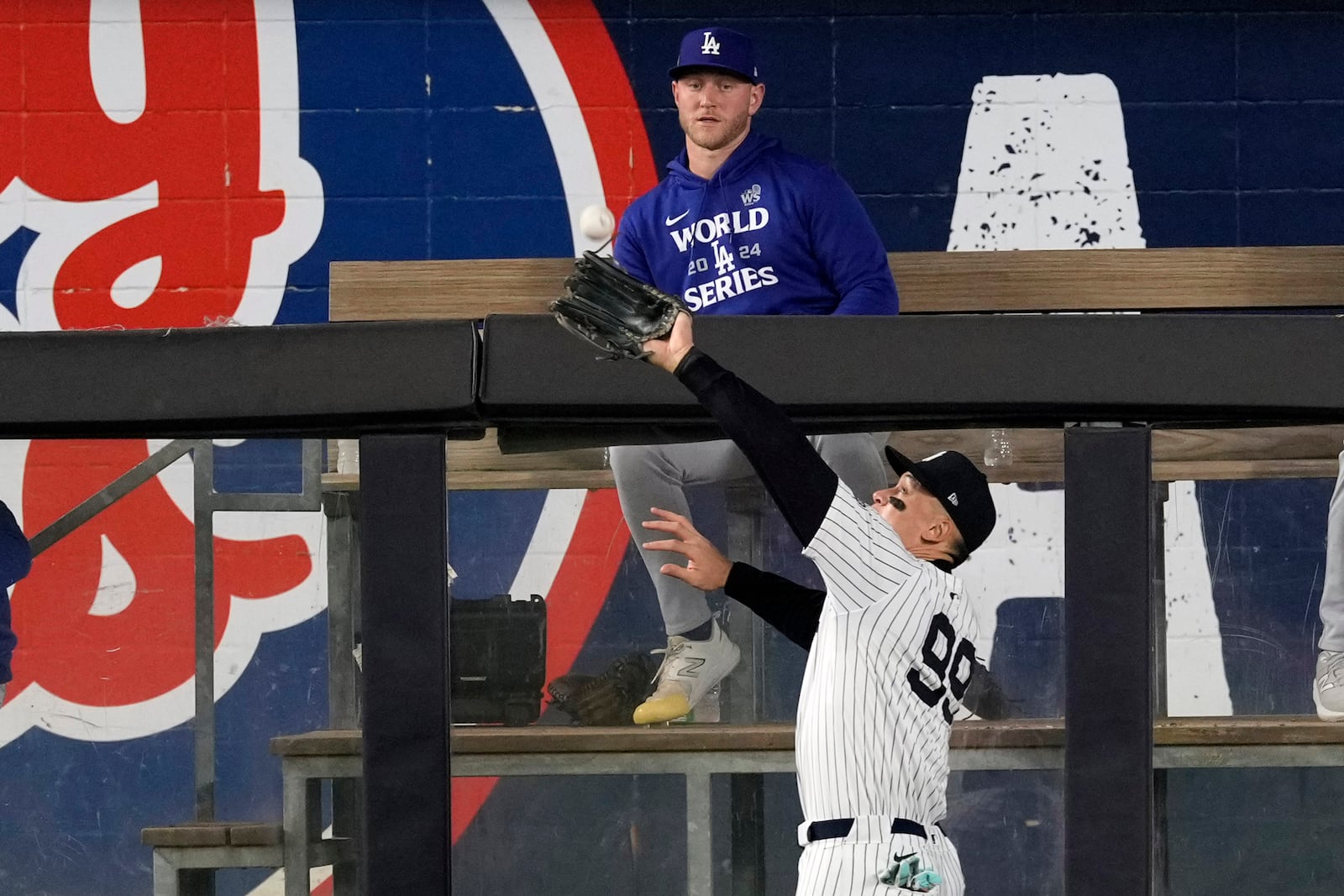 New York Yankees' Aaron Judge catches a fly ball by Los Angeles Dodgers' Freddie Freeman during the fourth inning in Game 5 of the baseball World Series, Wednesday, Oct. 30, 2024, in New York. (AP Photo/Seth Wenig)