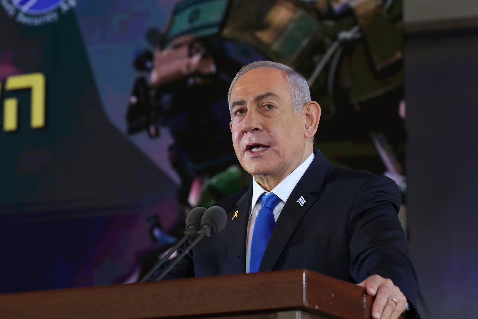 Israel's Prime Minister Benjamin Netanyahu speaks during a ceremony marking the Hebrew calendar anniversary of the Hamas attack on October 7 last year that sparked the ongoing war in Gaza, at the Mount Herzl military cemetery in Jerusalem, Israel Sunday Oct. 27, 2024. (Gil Cohen-Magen/Pool Photo via AP)