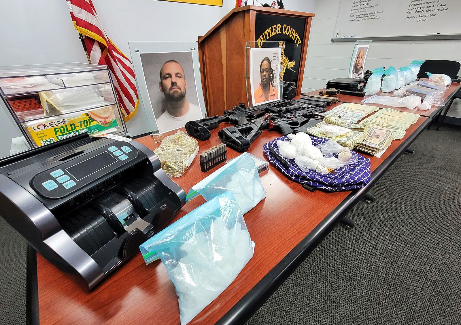 A four-month investigation by the Butler County Sheriff’s Office Undercover Regional Narcotics Unit and the Cincinnati DEA concluded Wednesday with the arrest of two men and seizure of guns, cash and drugs worth $100,000. NICK GRAHAM/STAFF