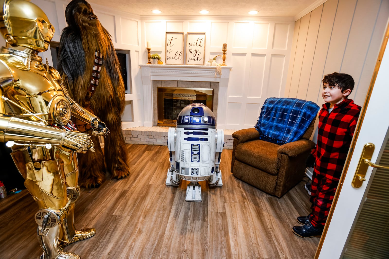 Porter Sowards, then a 10-year-old who was battling brain cancer, was surprised with a visit from Star Wars characters, C3PO, portrayed by Tim O'Sullivan, R2D2 and Chewbacca, portrayed by Joey Arielle, at his home on Nov. 12, 2021 in Middletown. NICK GRAHAM / STAFF