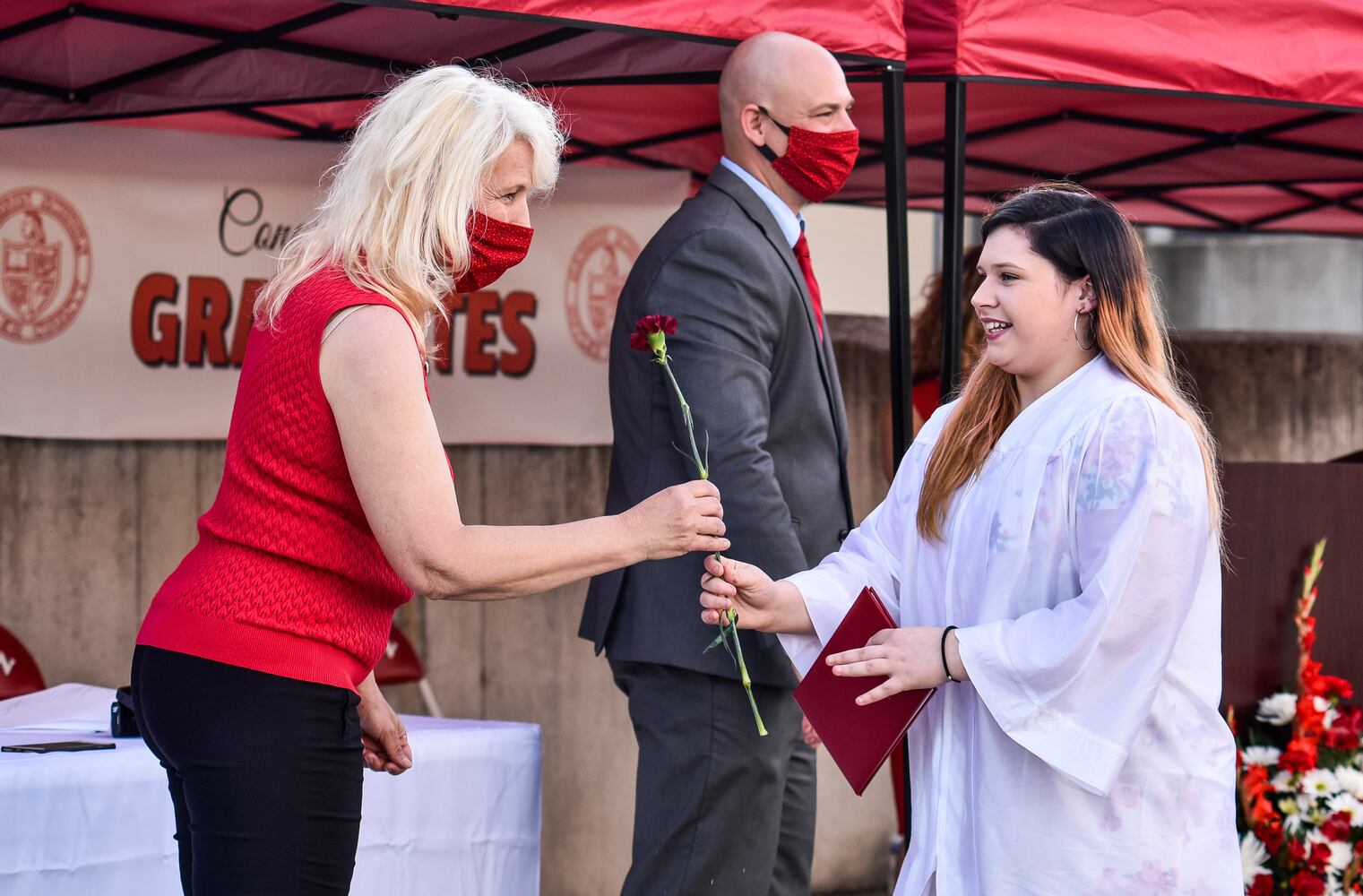 Madison High School drive-thru graduation ceremony at Land of Illusion