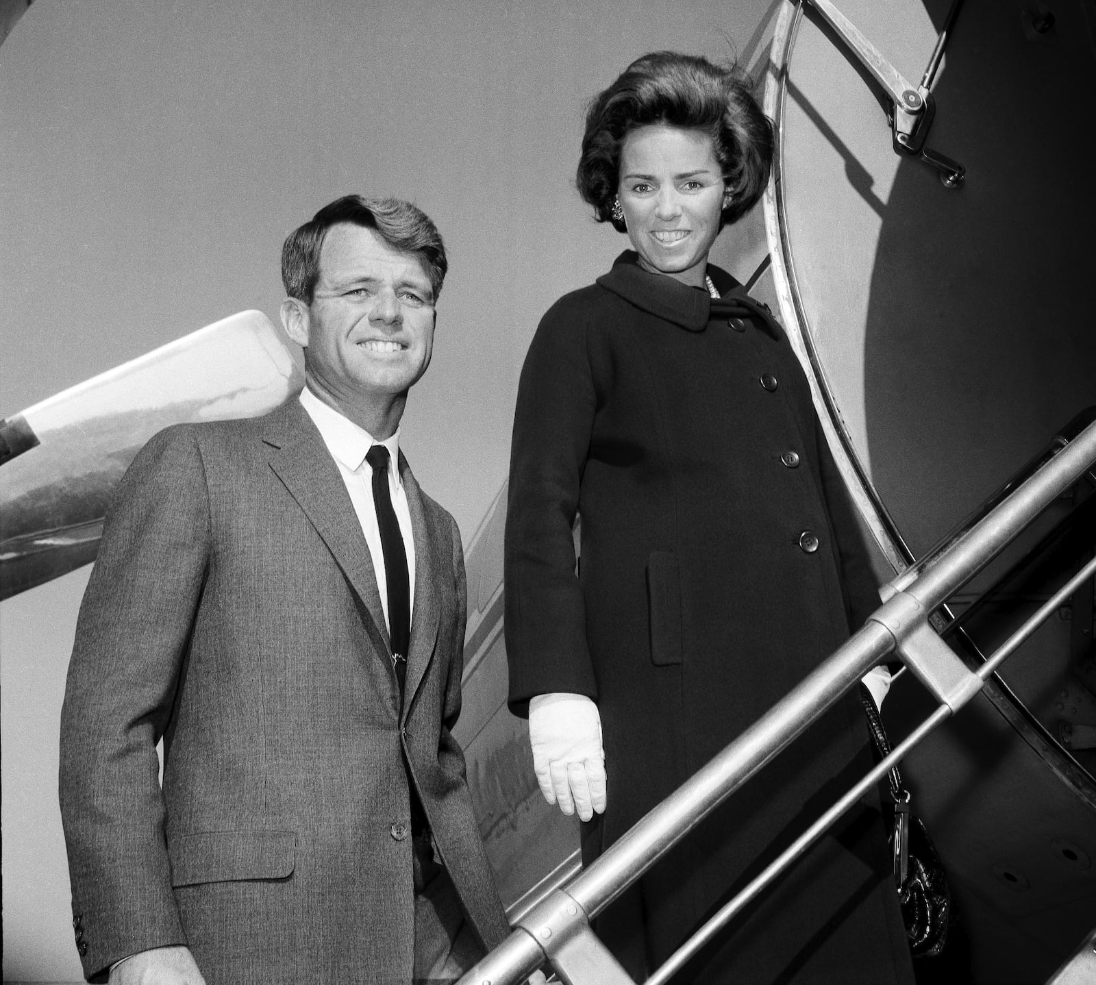 FILE - U.S. Senator-elect Robert F. Kennedy is shown with his wife Ethel boarding plane, Nov. 4, 1964, in New York City at LaGuardia Airport for flight to Glens Falls, N.Y. (AP Photo/File)