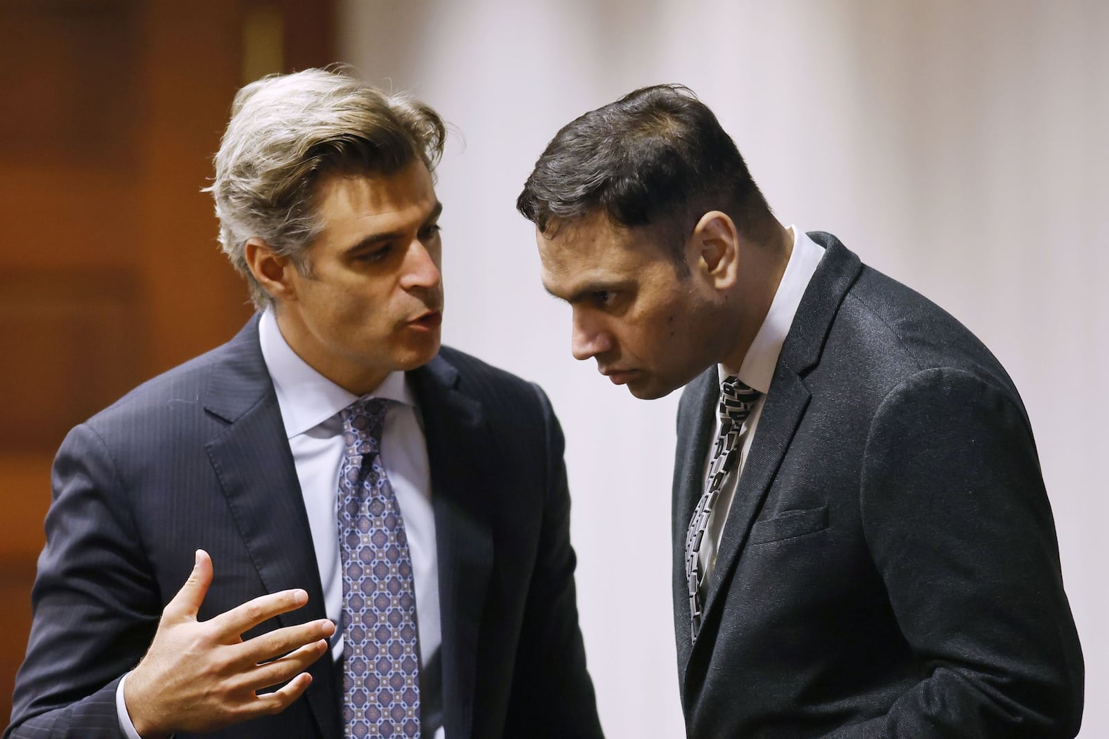 Defense attorney Charles M. Rittgers, left, talks with his client, Gurpreet Singh, during a motions hearing. The jury trial of Gurpreet Singh, charged with allegedly shooting and killing four family members in 2019 in West Chester Township, started with preliminary motions and jury selection Monday, Oct. 3, 2022 in a new super courtroom in Butler County Common Pleas Court in Hamilton. NICK GRAHAM/STAFF