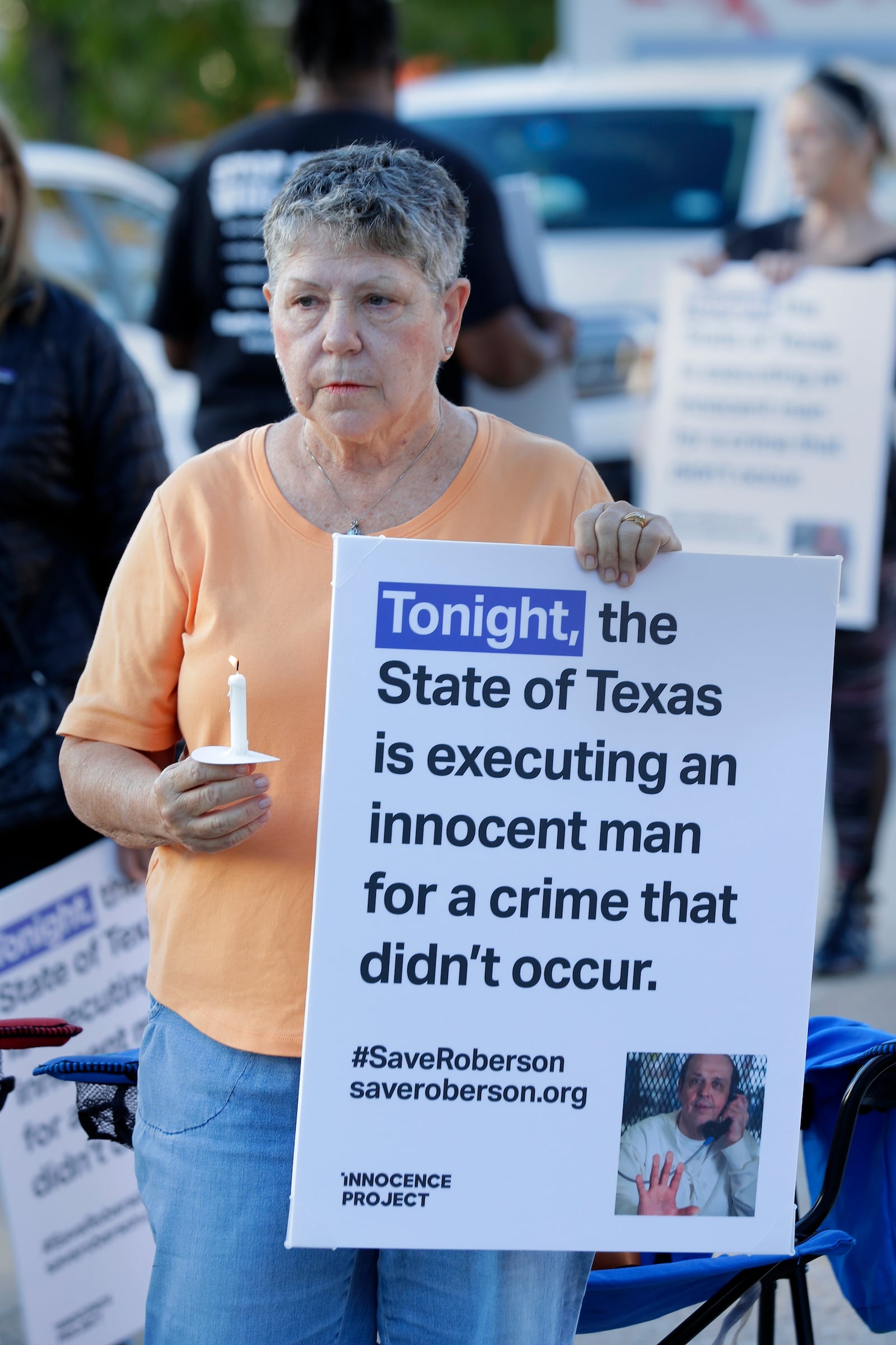 Ann Dorn, a local Catholic parishioner opposed to the death penalty, protest outside the prison where Robert Roberson is scheduled for execution at the Huntsville Unit of the Texas State Penitentiary, Thursday, Oct. 17, 2024, in Huntsville, Texas. (AP Photo/Michael Wyke)