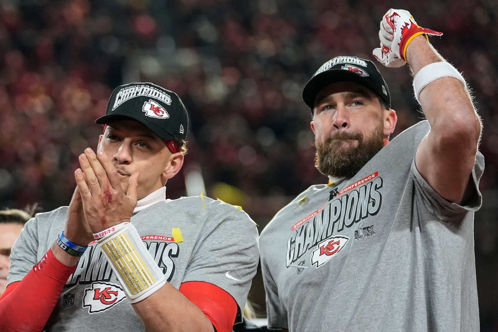 Kansas City Chiefs quarterback Patrick Mahomes and tight end Travis Kelce celebrate victory against the Buffalo Bills after the AFC Championship NFL football game, Sunday, Jan. 26, 2025, in Kansas City, Mo. (AP Photo/Ashley Landis)