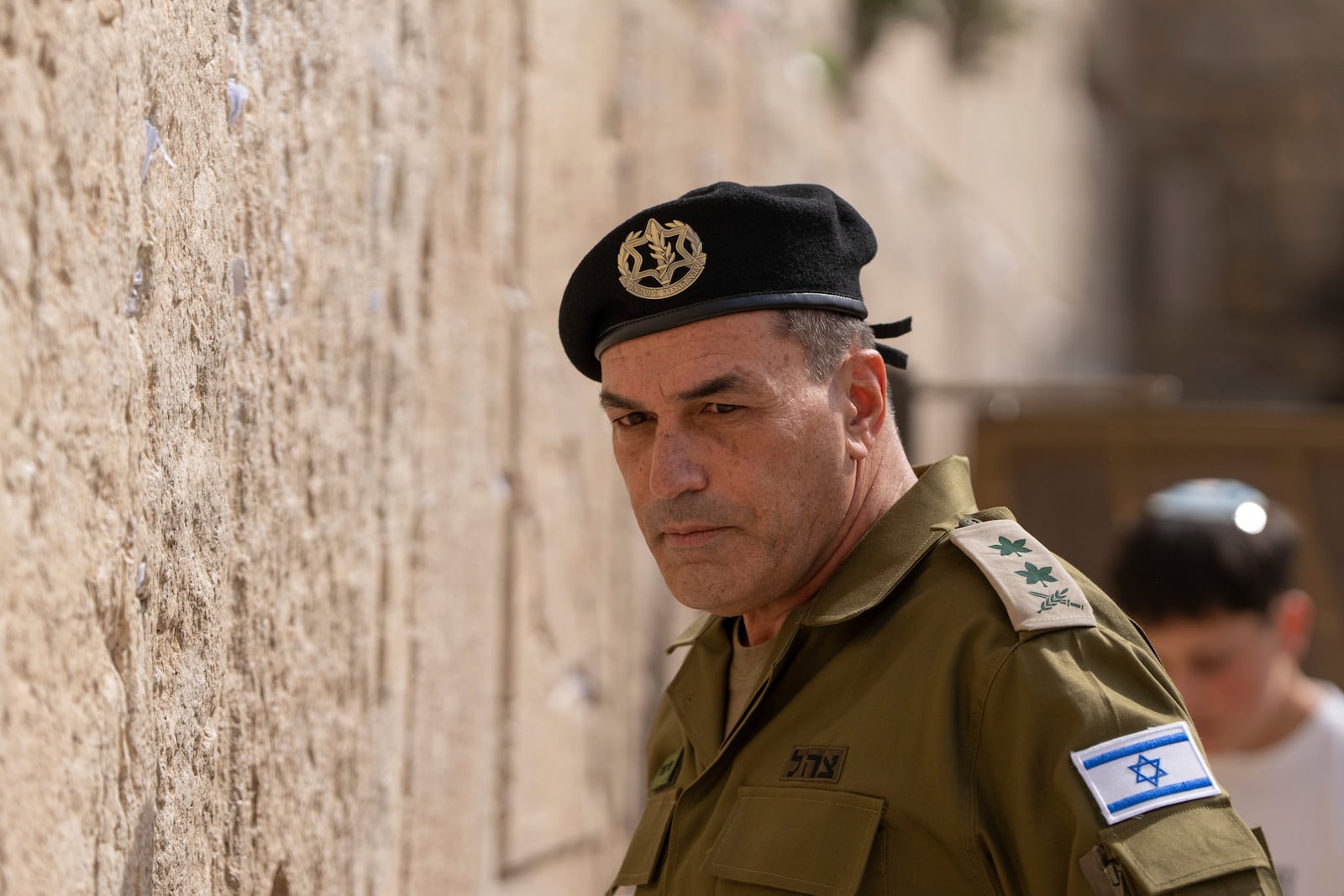 Israel's incoming military chief of staff, Lt. Gen. Eyal Zamir places notes in the Western Wall, the holiest site where Jews can pray, in Jerusalem's Old City on Wednesday, March 5, 2025. (AP Photo/Ohad Zwigenberg)