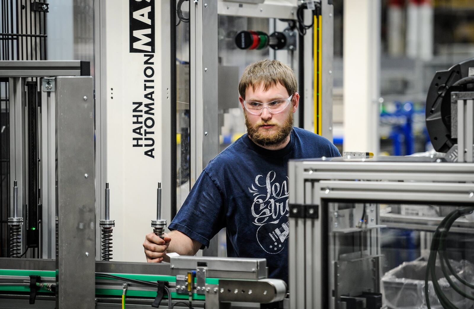 Jesse Lovins works in the M300 assembly section where robots are used for certain parts of the assembly process Thursday, April 20 at ThyssenKrupp Bilstein in Hamilton. 