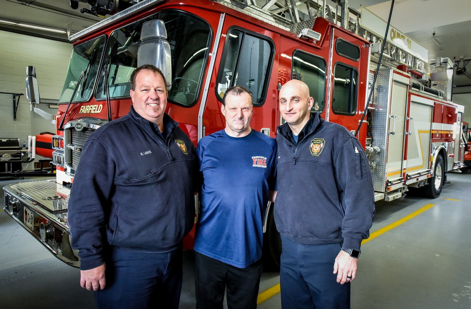 Duane Sparks (middle) with Fairfield firefighter paramedics Rob Lance (left) and Scott Goller (right) at the Fairifield Fire Department headquarters on Nilles Road. Sparks has developed a special relationship with the Fairfield Fire Department.