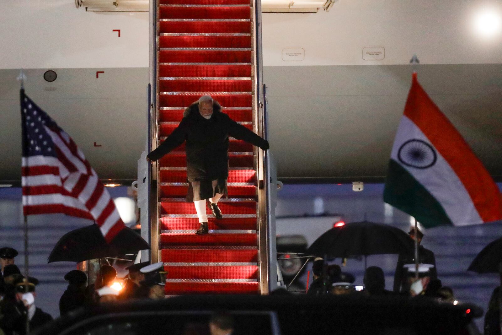 India's Prime Minister Narendra Modi walks down the stairs from his plane upon his arrival at Joint Base Andrews, Md., Wednesday, Feb. 12, 2025. (AP Photo/Luis M. Alvarez)