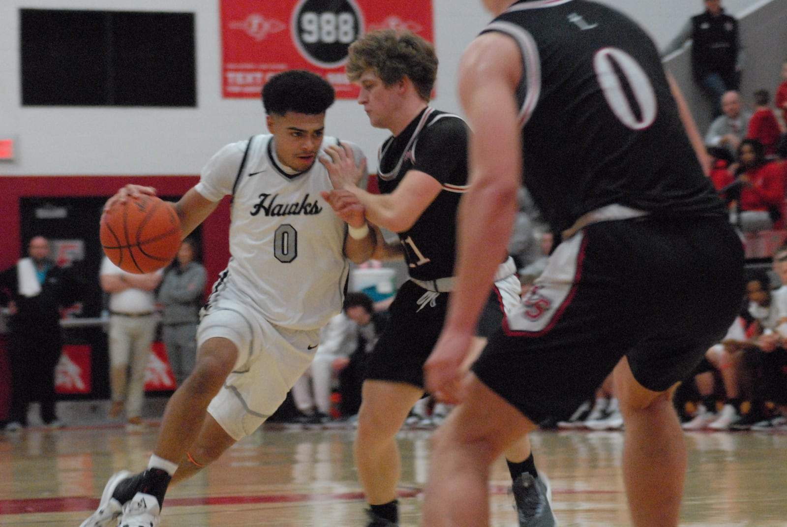 Lakota East's Trey Perry (0) is guarded by La Salle's Cohen Kreidler on Friday night. Chris Vogt/CONTRIBUTED