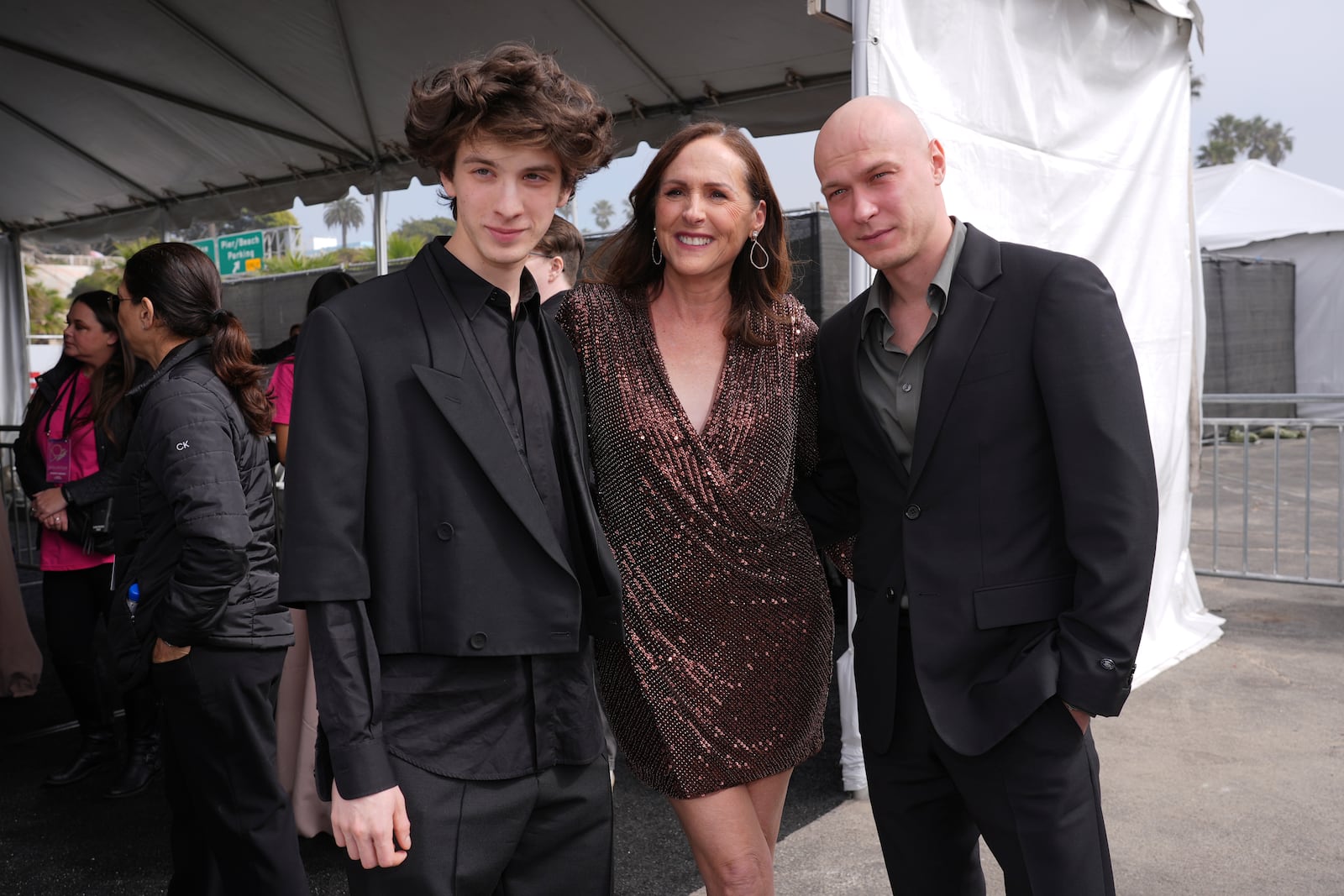 Mark Eydelshteyn, from left, Molly Shannon and Yuriy Borisov arrive at the Film Independent Spirit Awards on Saturday, Feb. 22, 2025, in Santa Monica, Calif. (AP Photo/Chris Pizzello)