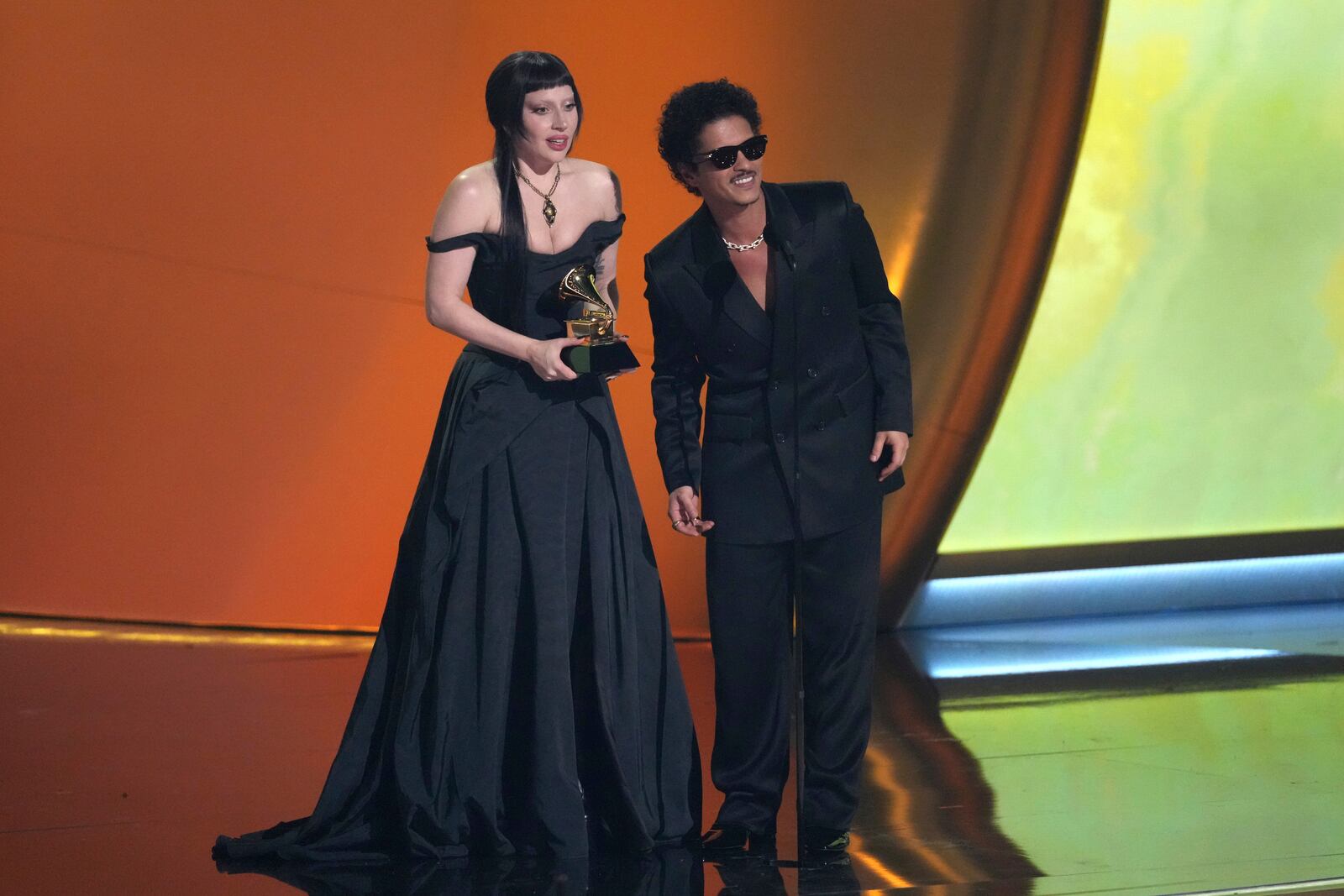 Lady Gaga, left, and Bruno Mars accept the award for best pop duo/group performance for "Die With A Smile" during the 67th annual Grammy Awards on Sunday, Feb. 2, 2025, in Los Angeles. (AP Photo/Chris Pizzello)