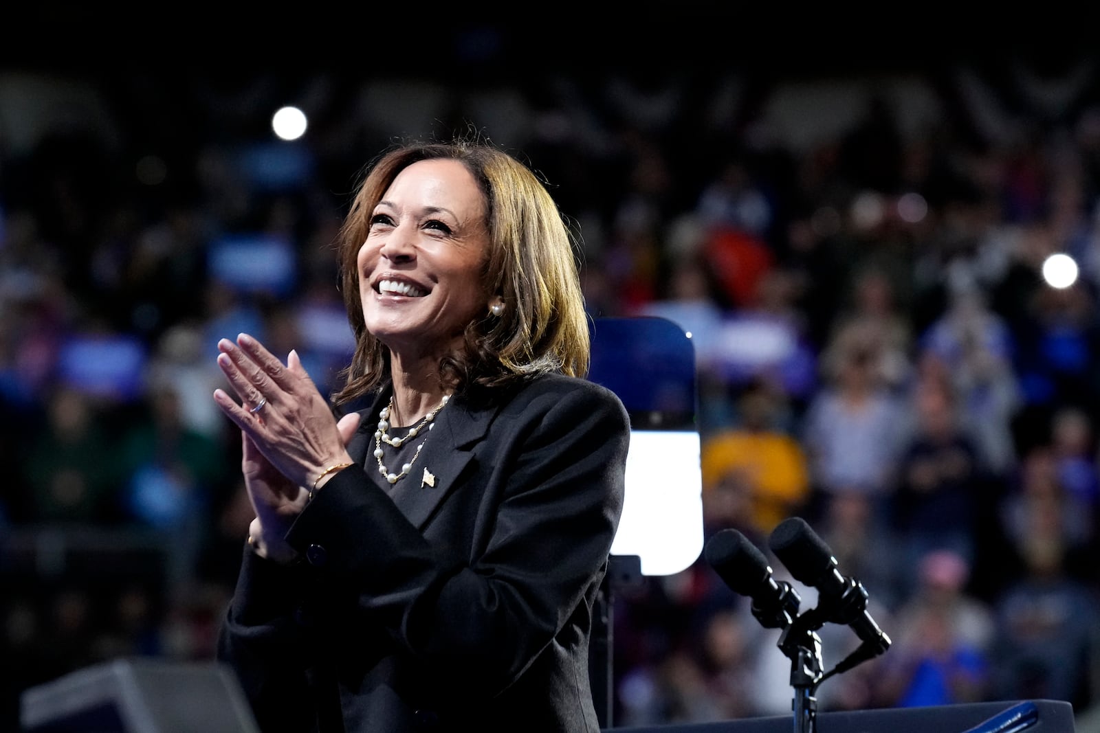 Democratic presidential nominee Vice President Kamala Harris claps on stage during a campaign rally at Erie Insurance Arena, in Erie, Pa., Monday, Oct. 14, 2024. (AP Photo/Jacquelyn Martin)