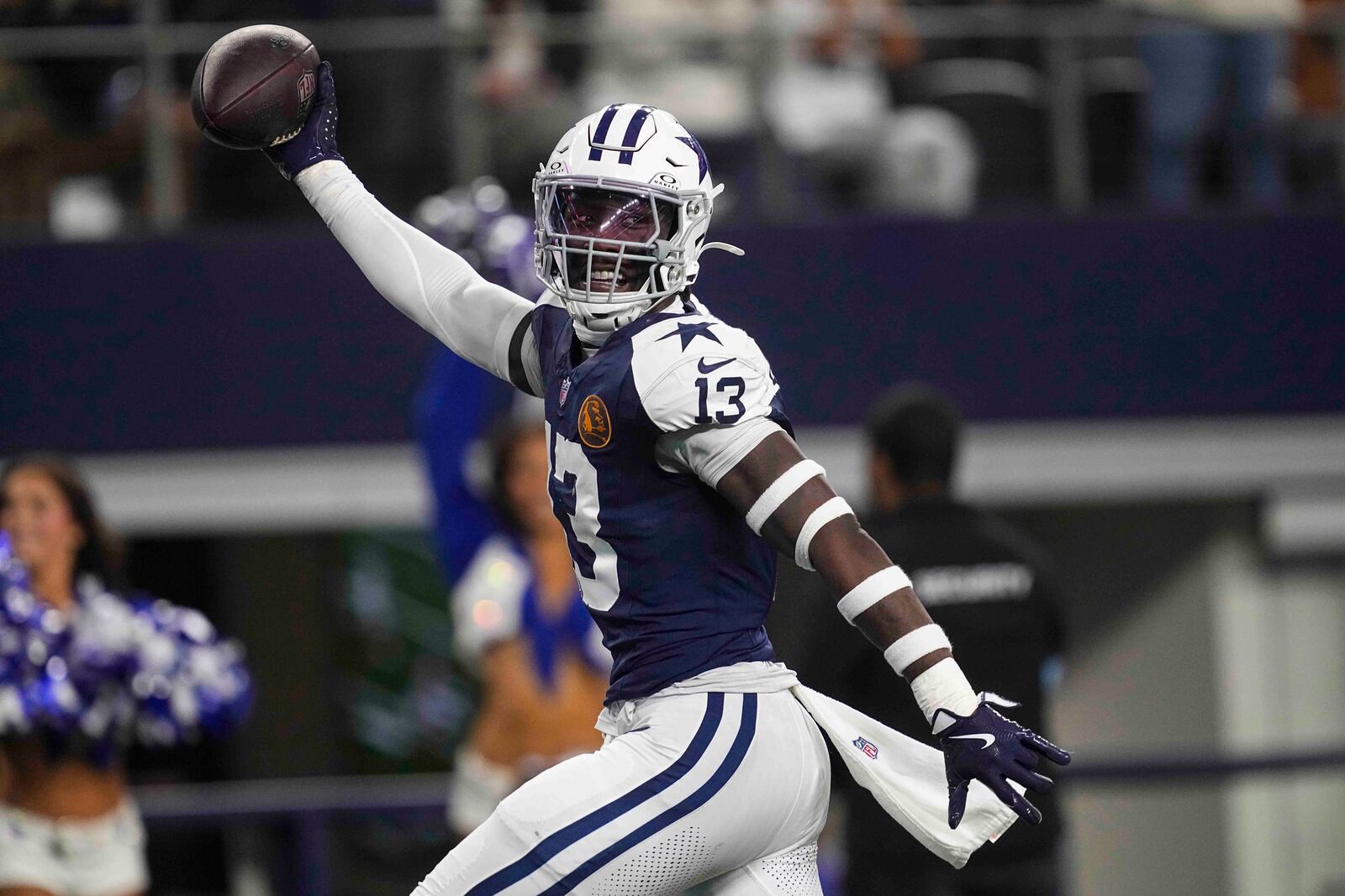 Dallas Cowboys linebacker DeMarvion Overshown (13) celebrates as he runs in for a touchdown on interception against the New York Giants during the first half of an NFL football game in Arlington, Texas, Thursday, Nov. 28, 2024. (AP Photo/Tony Gutierrez)