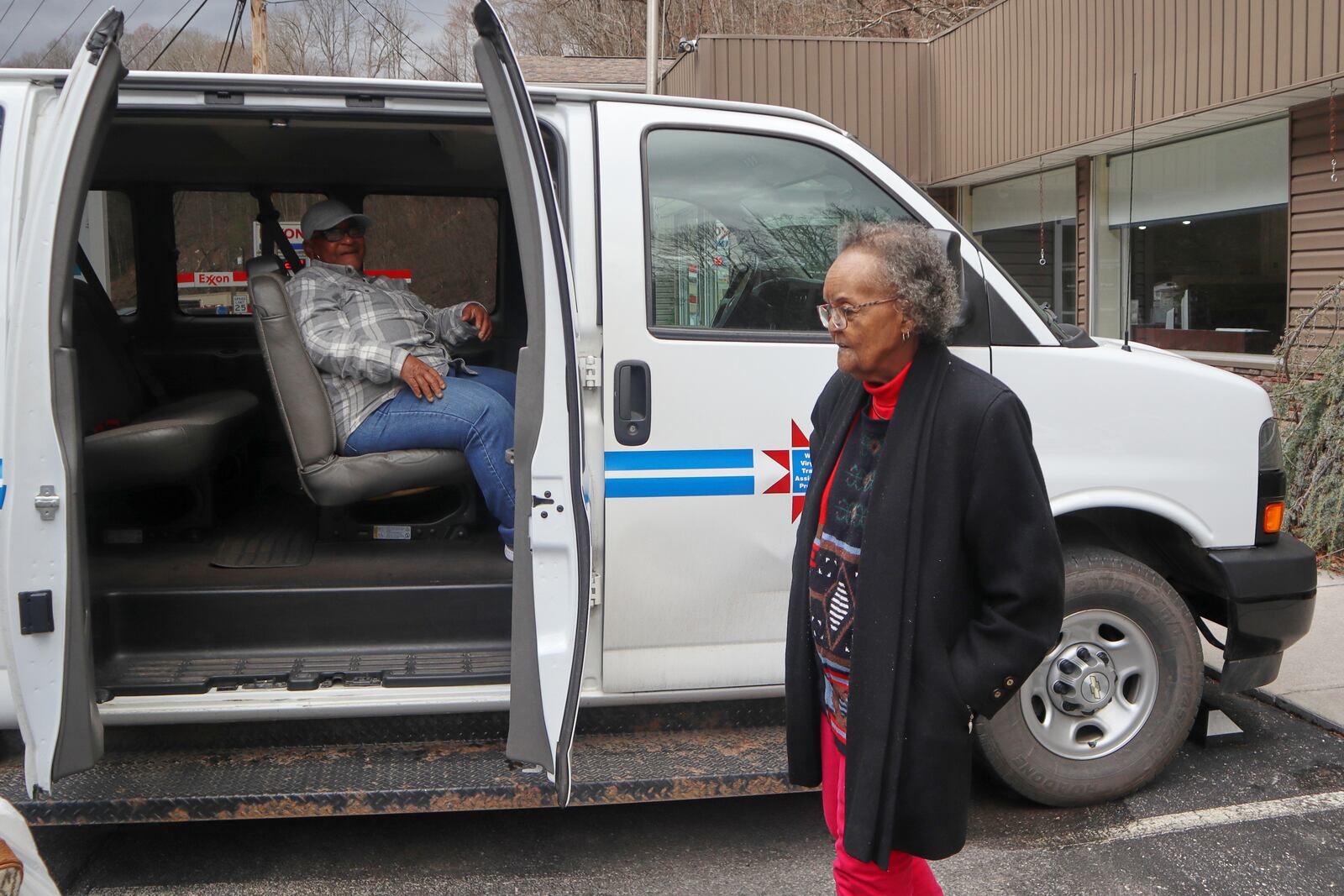 Mary Weaver, right, and Veronia Taylor get into a van as they leave the McDowell County Commission on Aging Senior Center in Welch, W.Va., Thursday, March 20, 2025. (AP Photo/Leah Willingham)