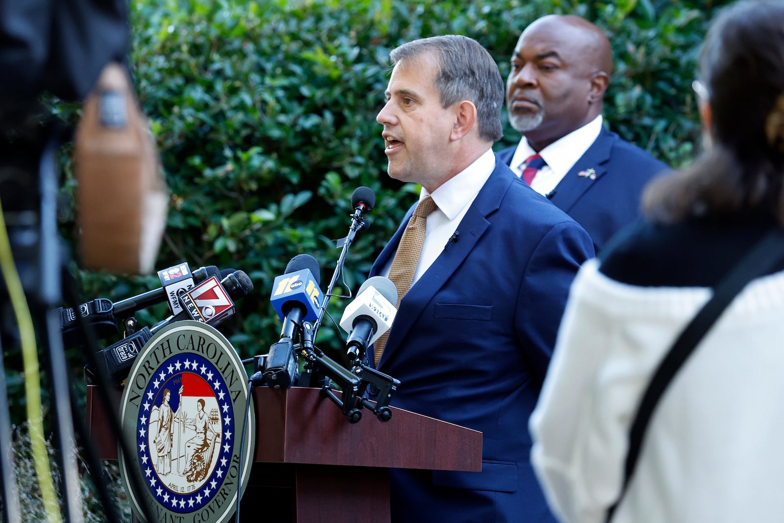 Attorney Jesse Binnall, left, speaks at a news conference, with his client North Carolina Lt. Gov. Mark Robinson, right, in Raleigh, N.C., Tuesday, Oct. 15, 2024. (AP Photo/Karl B DeBlaker)