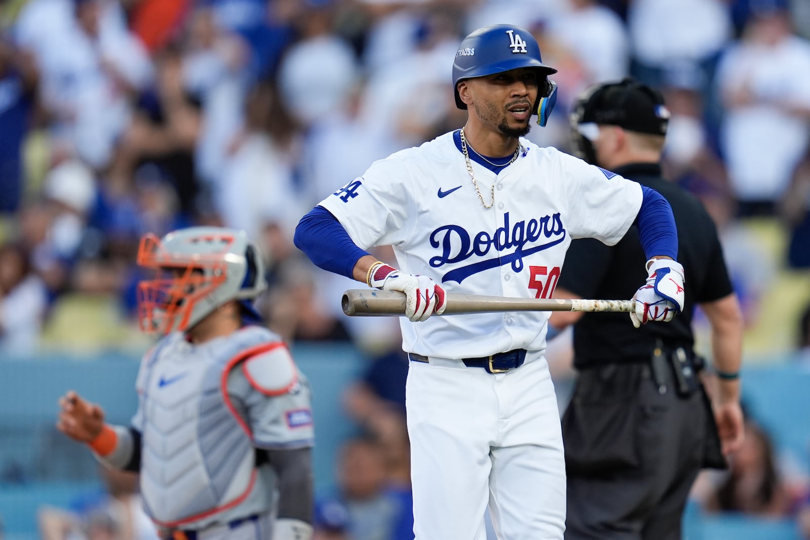 Los Angeles Dodgers' Mookie Betts reacts after striking out against the New York Mets during the ninth inning in Game 2 of a baseball NL Championship Series, Monday, Oct. 14, 2024, in Los Angeles. (AP Photo/Gregory Bull)