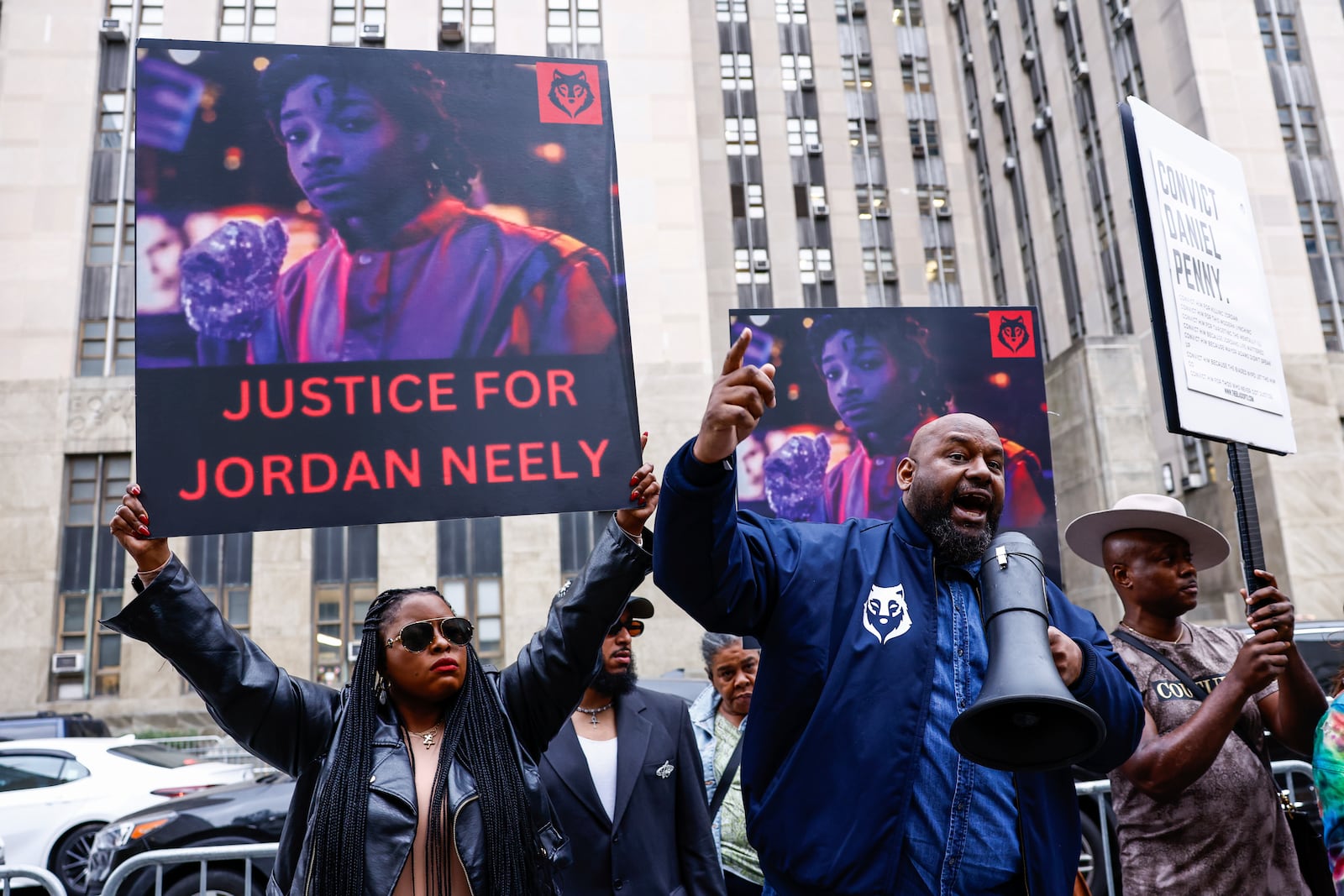 Protestors gather before Daniel Penny, the white veteran accused of choking a distressed Black subway rider to death, arrives for opening statements at the court in New York, Friday, Nov. 1, 2024.(AP Photo/Kena Betancur)