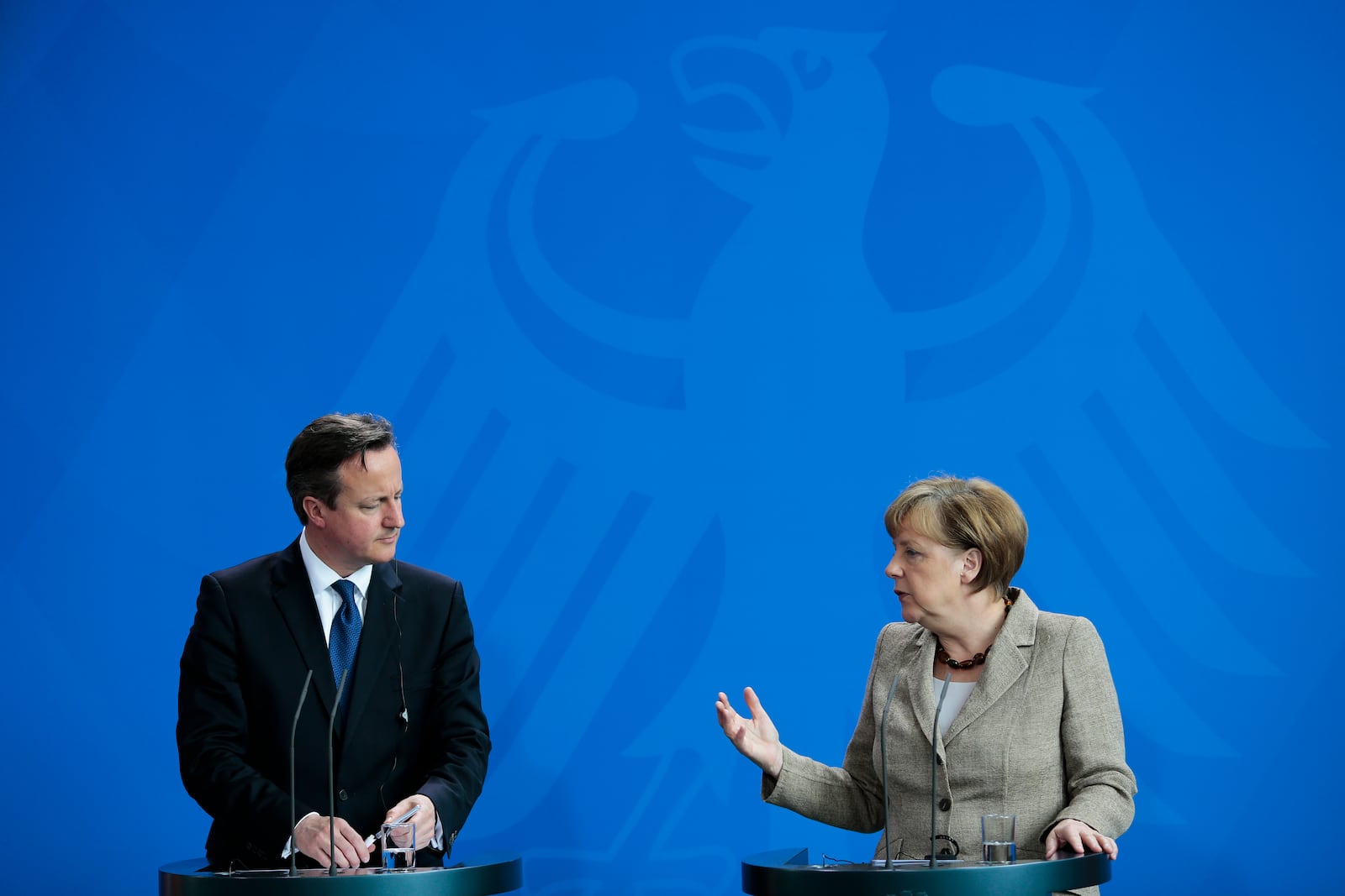 FILE - German Chancellor Angela Merkel, right, and British Prime Minister David Cameron brief the media after meeting at the chancellery in Berlin, Germany, Friday, May 29, 2015. (AP Photo/Markus Schreiber, File)