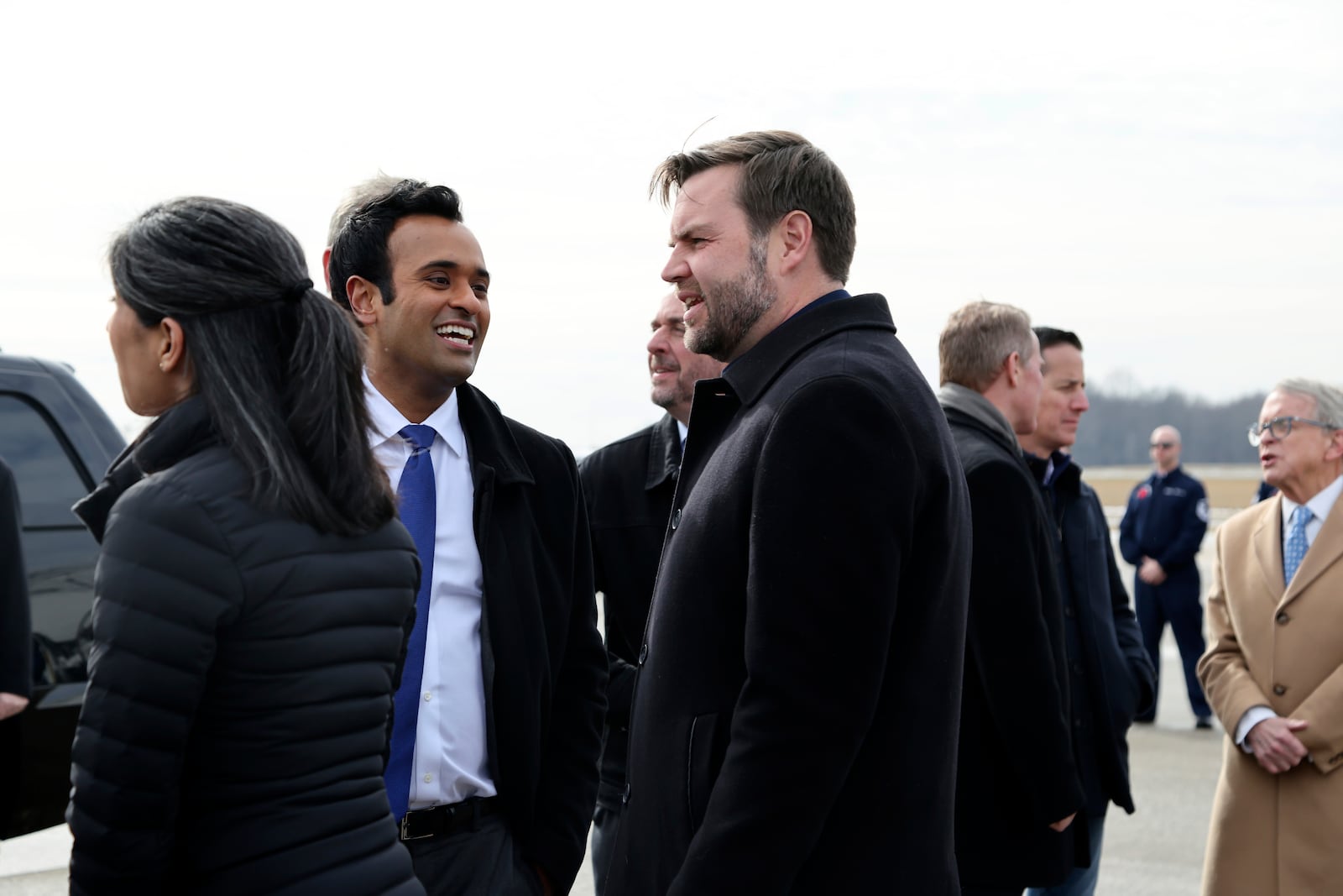 Vice President JD Vance, center, speaks with Vivek Ramaswamy as Vance and his wife Usha Vance arrive at Youngstown Air Reserve Station in Vienna Ohio, en route to East Palestine, Ohio, on Monday, Feb. 3, 2025. (Rebecca Droke/Pool Photo via AP