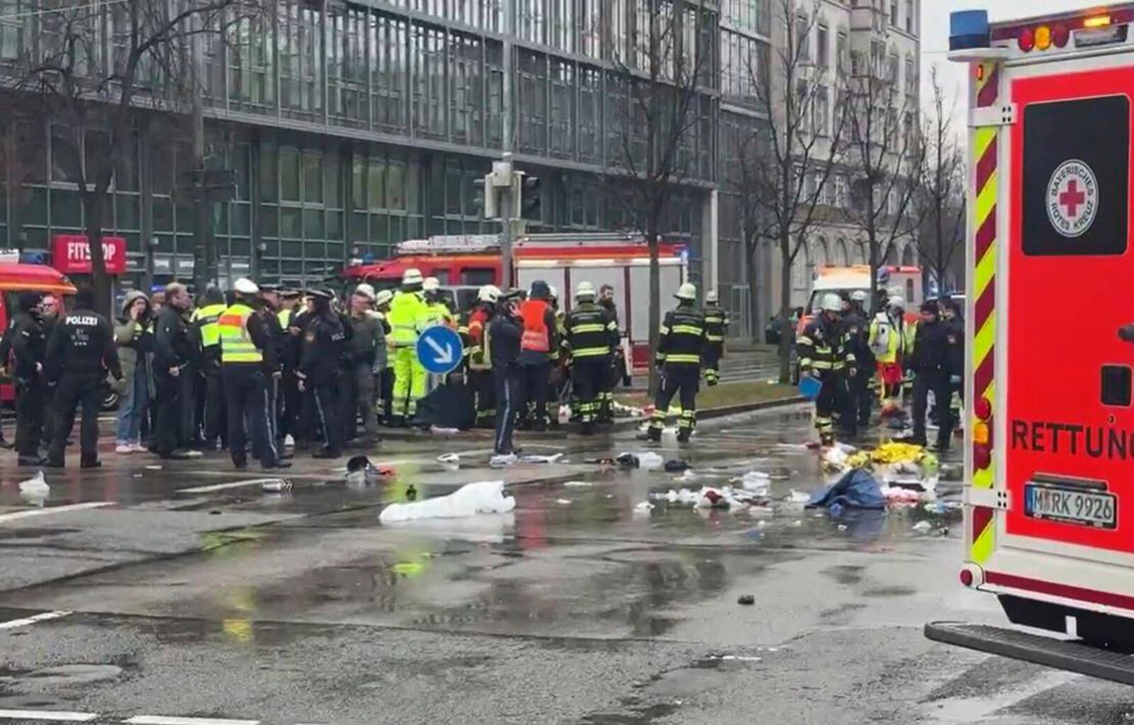 Emergency services attend the scene of an accident after a driver hit a group of people in Munich, Germany, Thursday Feb. 13, 2025. (Peter Kneffel/dpa via AP)