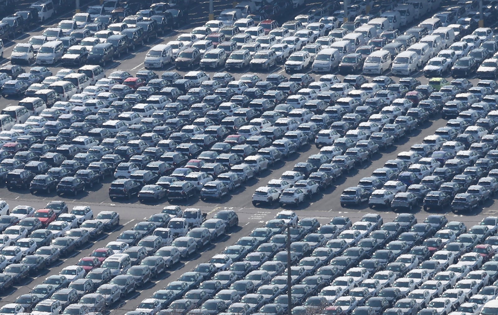 Vehicles are parked to be exported at a port next to Hyundai Motor's manufacturing facility in Ulsan, South Korea, Tuesday, Feb. 11, 2025. (Kim Yong-tea/Yonhap via AP)