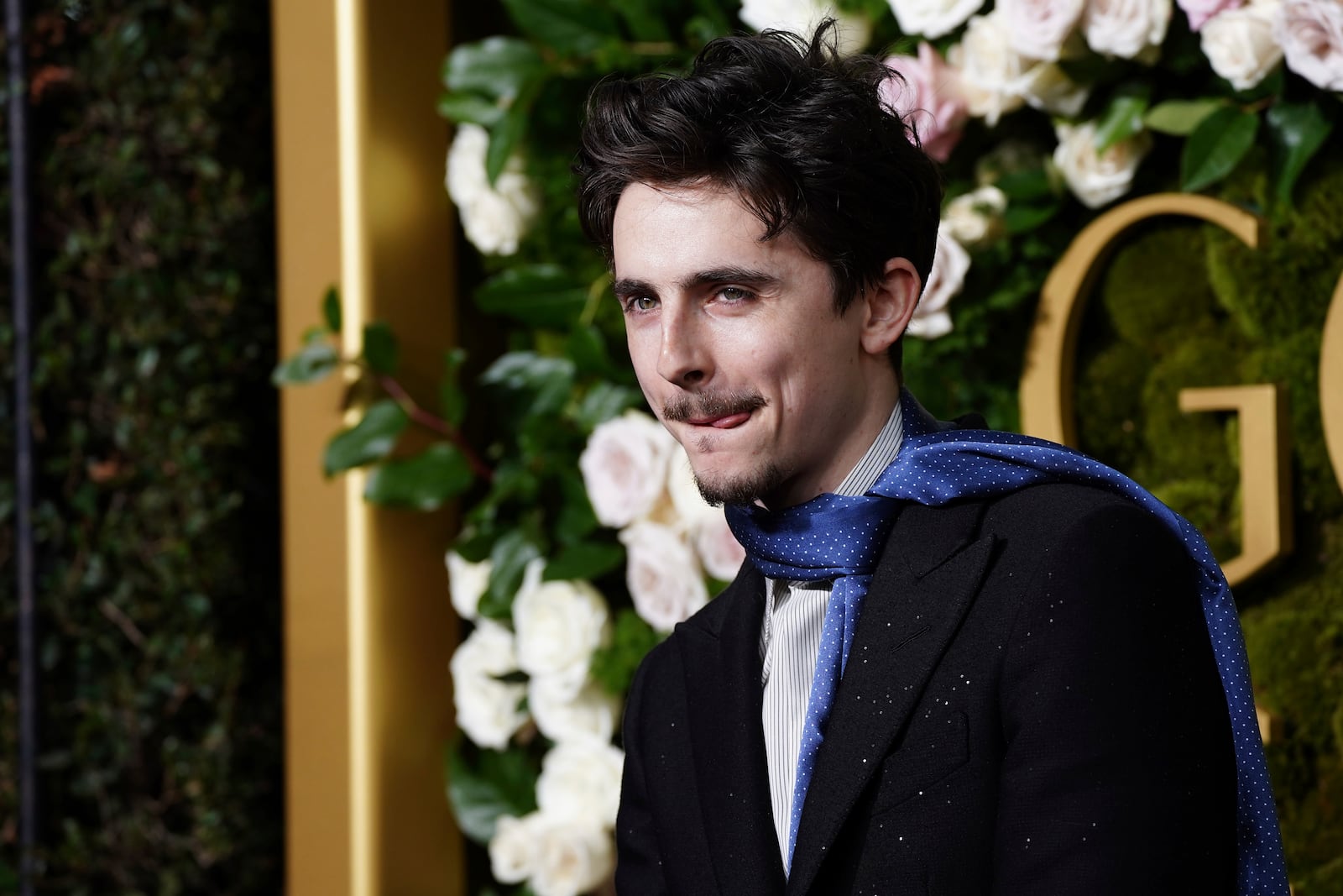 Timothee Chalamet arrives at the 82nd Golden Globes on Sunday, Jan. 5, 2025, at the Beverly Hilton in Beverly Hills, Calif. (Photo by Jordan Strauss/Invision/AP)