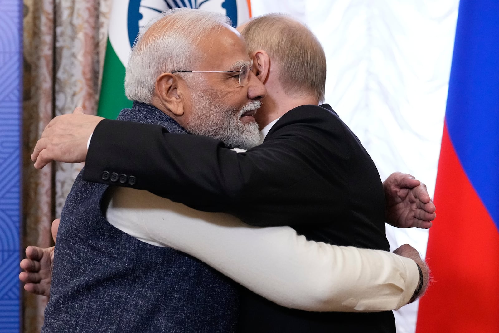 Russian President Vladimir Putin, right, embraces Indian Prime Minister Narendra Modi during their meeting on the sidelines of BRICS Summit at Kazan Kremlin in Kazan, Russia, Tuesday, Oct. 22, 2024. (AP Photo/Alexander Zemlianichenko, Pool)