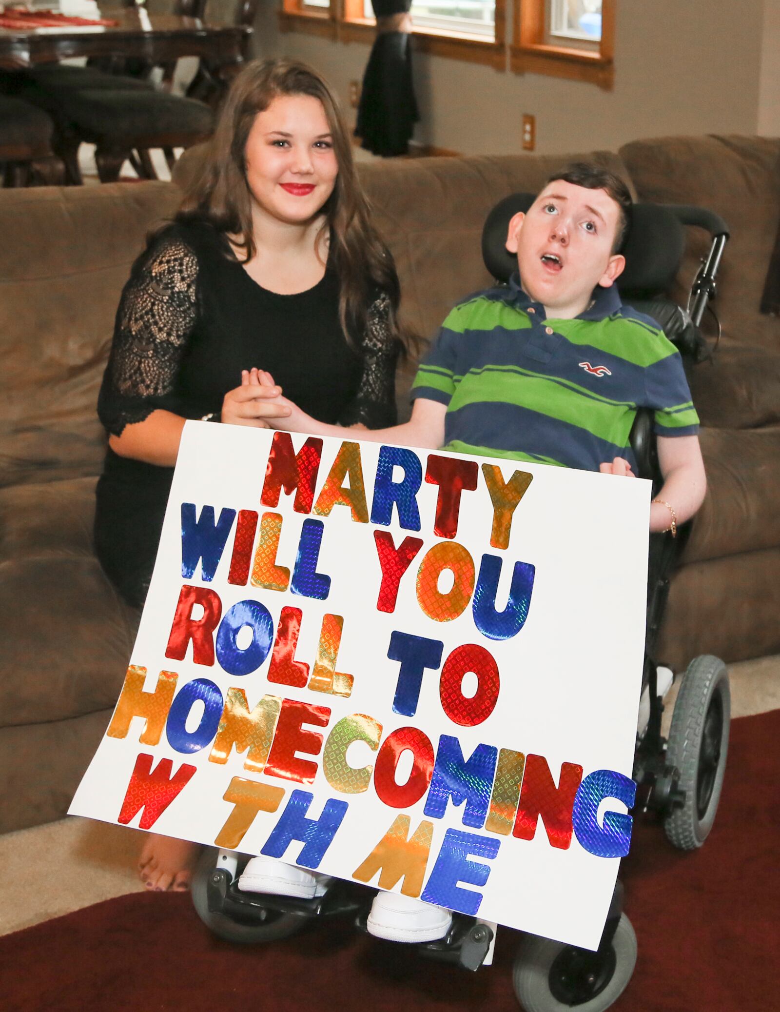 Middletown sophomore Alexis Taylor is excited about going to homecoming with one of her best friends, Marty Ary. Marty uses a wheelchair after a near drowning accident 13 years ago. The two have been friends since grade school. GREG LYNCH / STAFF