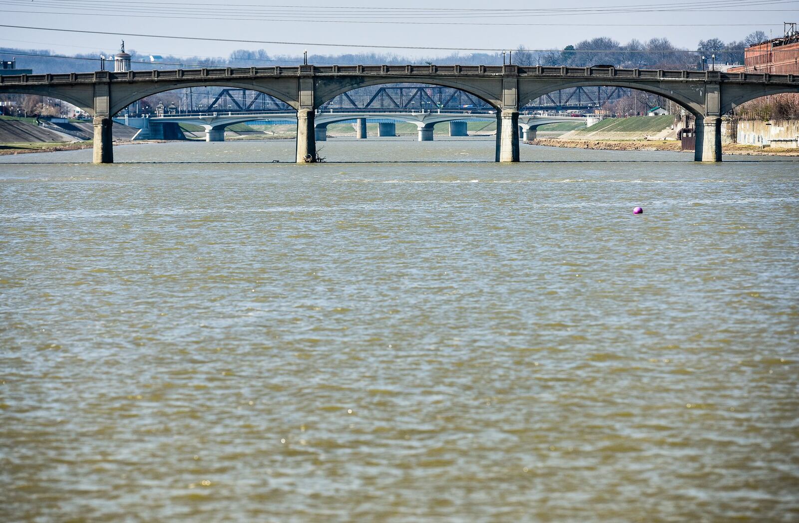 The Black Street bridge and High-Main bridge are visible from Combs Park along the Great Miami River in Hamilton. 