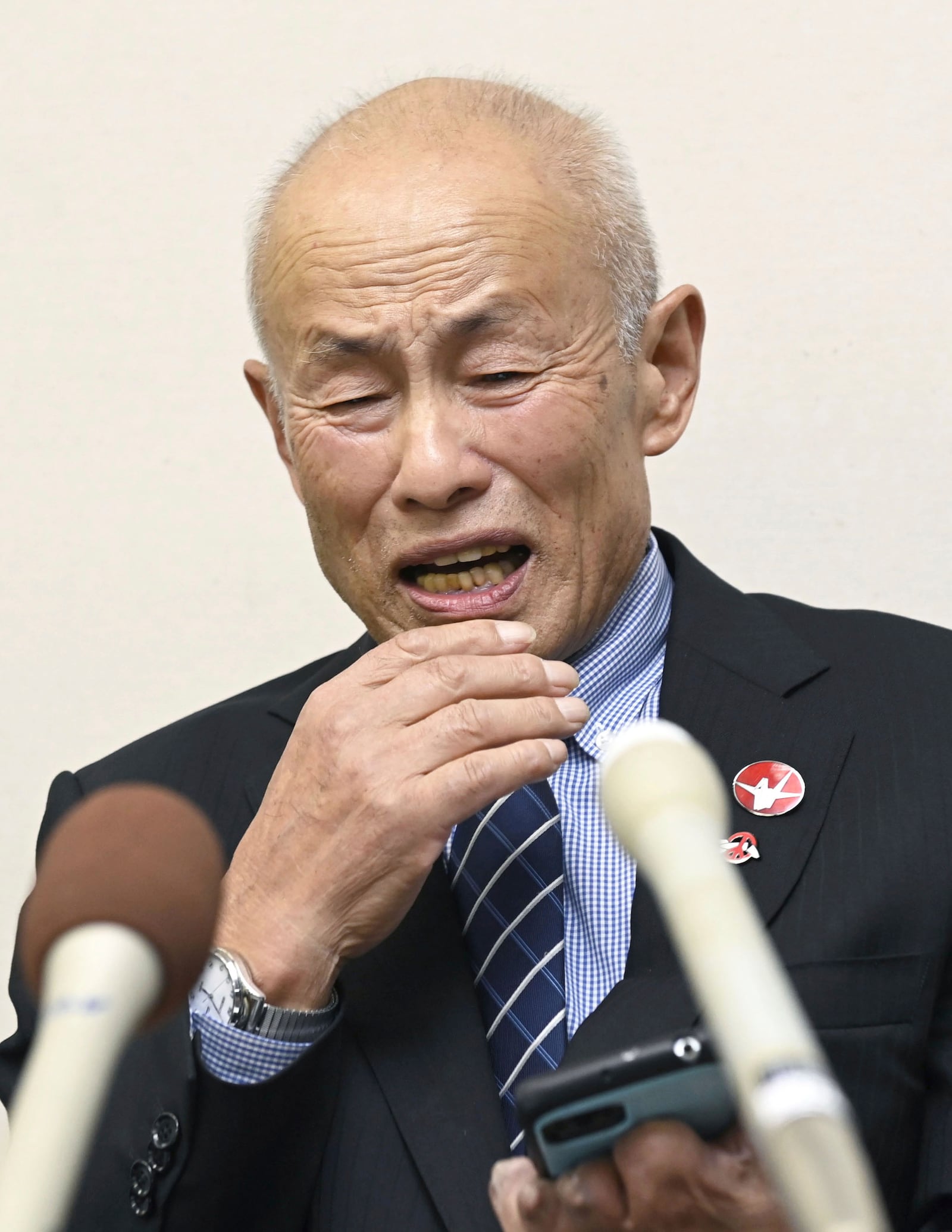 Toshiyuki Mimaki, president of Nihon Hidankyo, or the Japan Confederation of A- and H-Bomb Sufferers Organizations, reacts as he speaks to media members in Hiroshima, western Japan, Friday, Oct. 11, 2024, following Nihon Hidankyo's winning the Nobel Peace Prize. (Moe Sasaki/Kyodo News via AP)