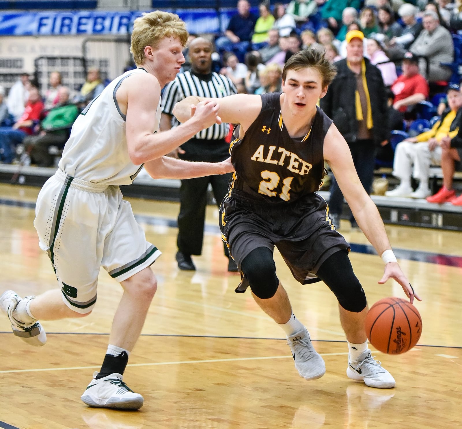 Alter’s Connor Bazelak dribbles around Badin’s Kyle Young during a Division II sectional semifinal Feb. 27, 2018, at Fairmont’s Trent Arena. Alter won 60-51. NICK GRAHAM/STAFF