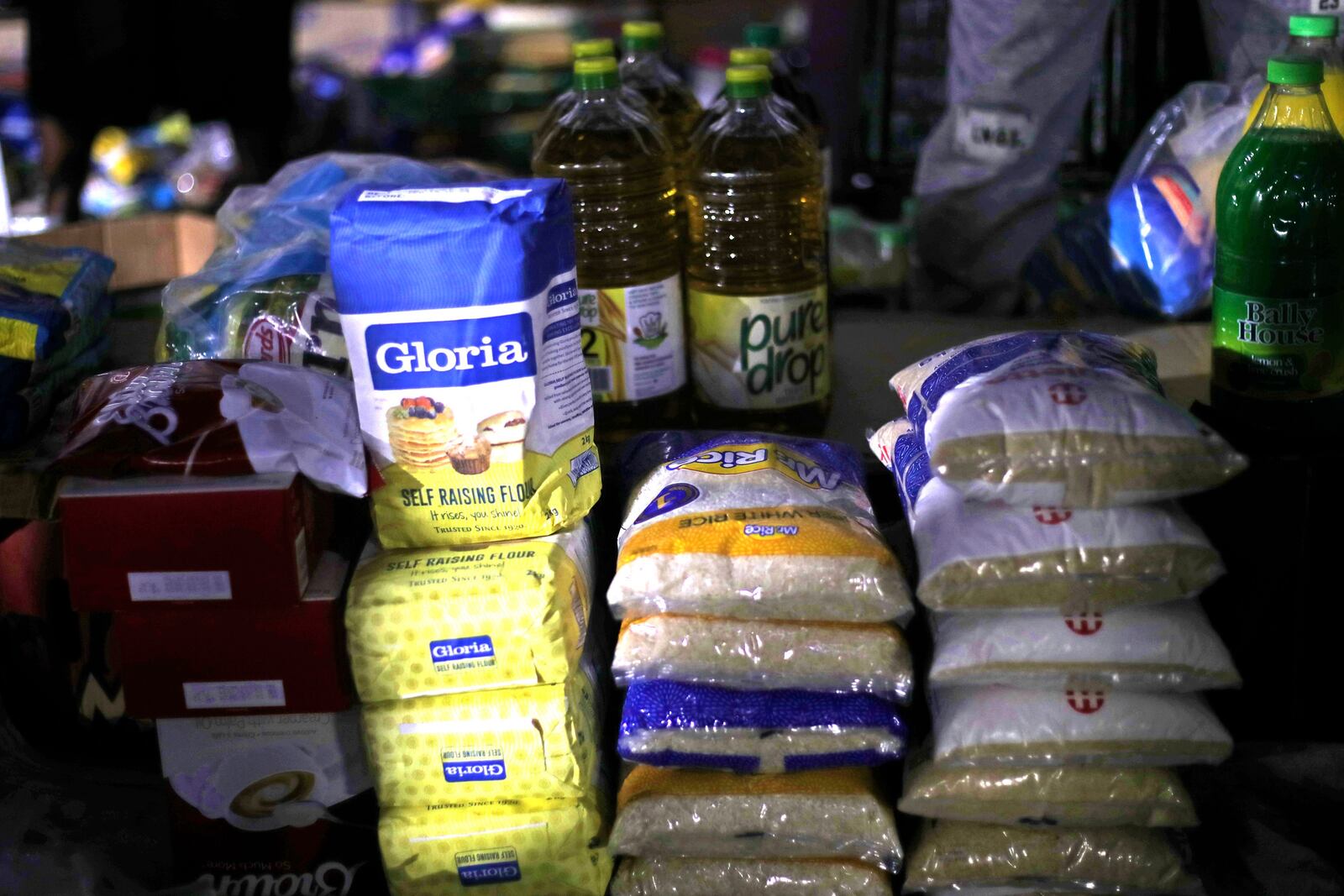 Basic commodities sit on display at informal and illegal markets that pop up at night to avoid police raids in central Harare, Zimbabwe, Friday, Nov. 11, 2024. (AP Photo/Aaron Ufumeli)