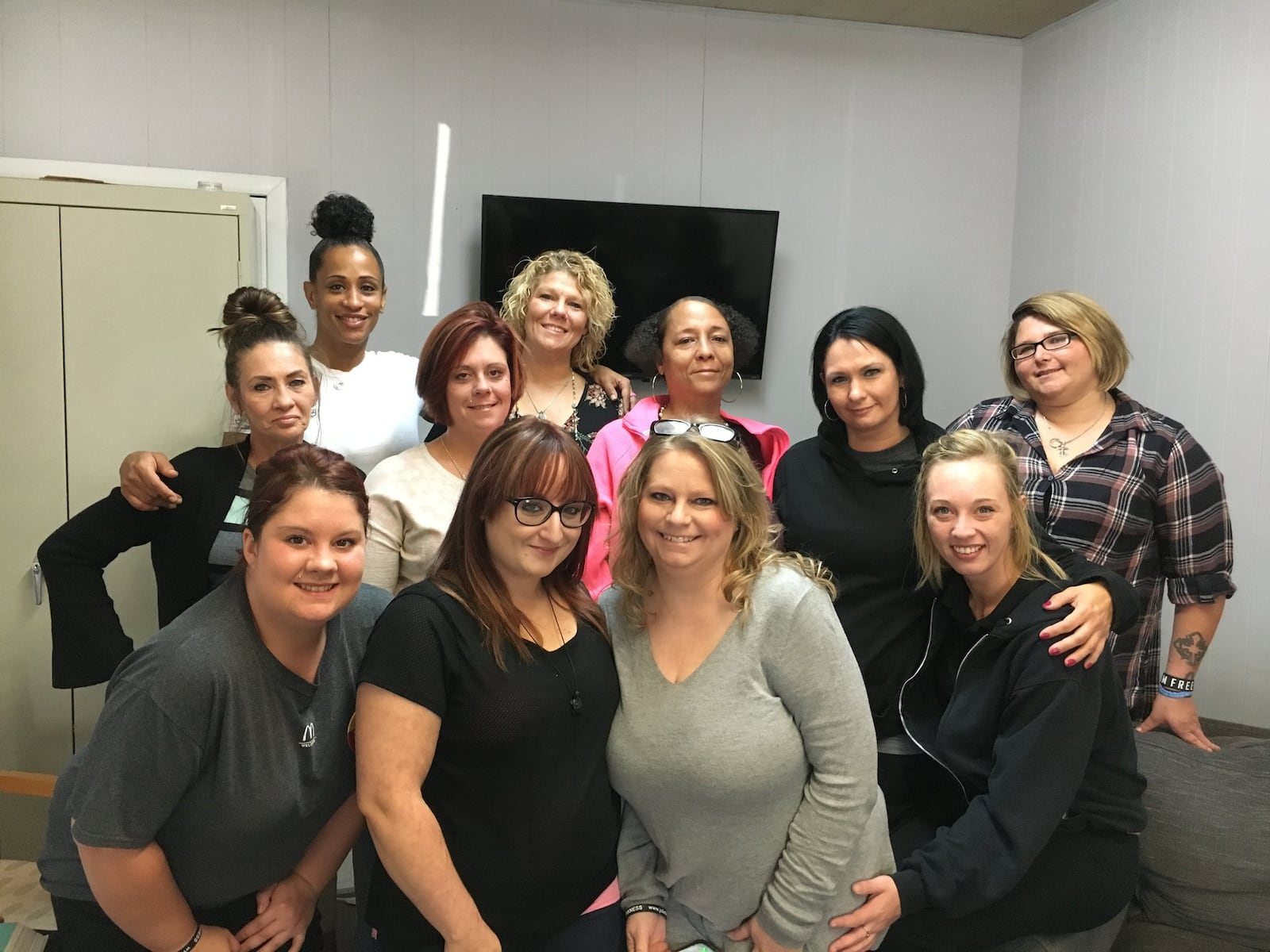 The 10 women in the Juliette's Hope program, plus the Rev. Kim Russo, who founded it. Russo is in the front row, third from the left. MIKE RUTLEDGE/STAFF