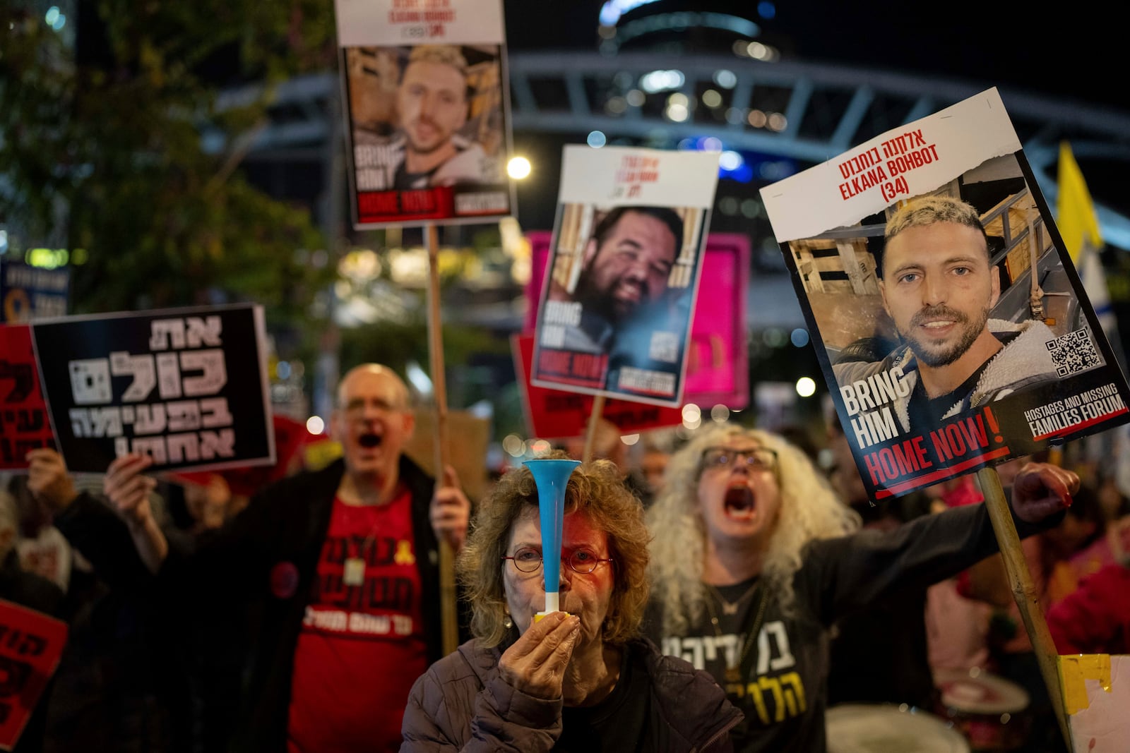 People take part in a protest in Tel Aviv, Israel, Sunday, March 9, 2025, demanding the immediate release of hostages held by Hamas in the Gaza Strip. (AP Photo/Ohad Zwigenberg)