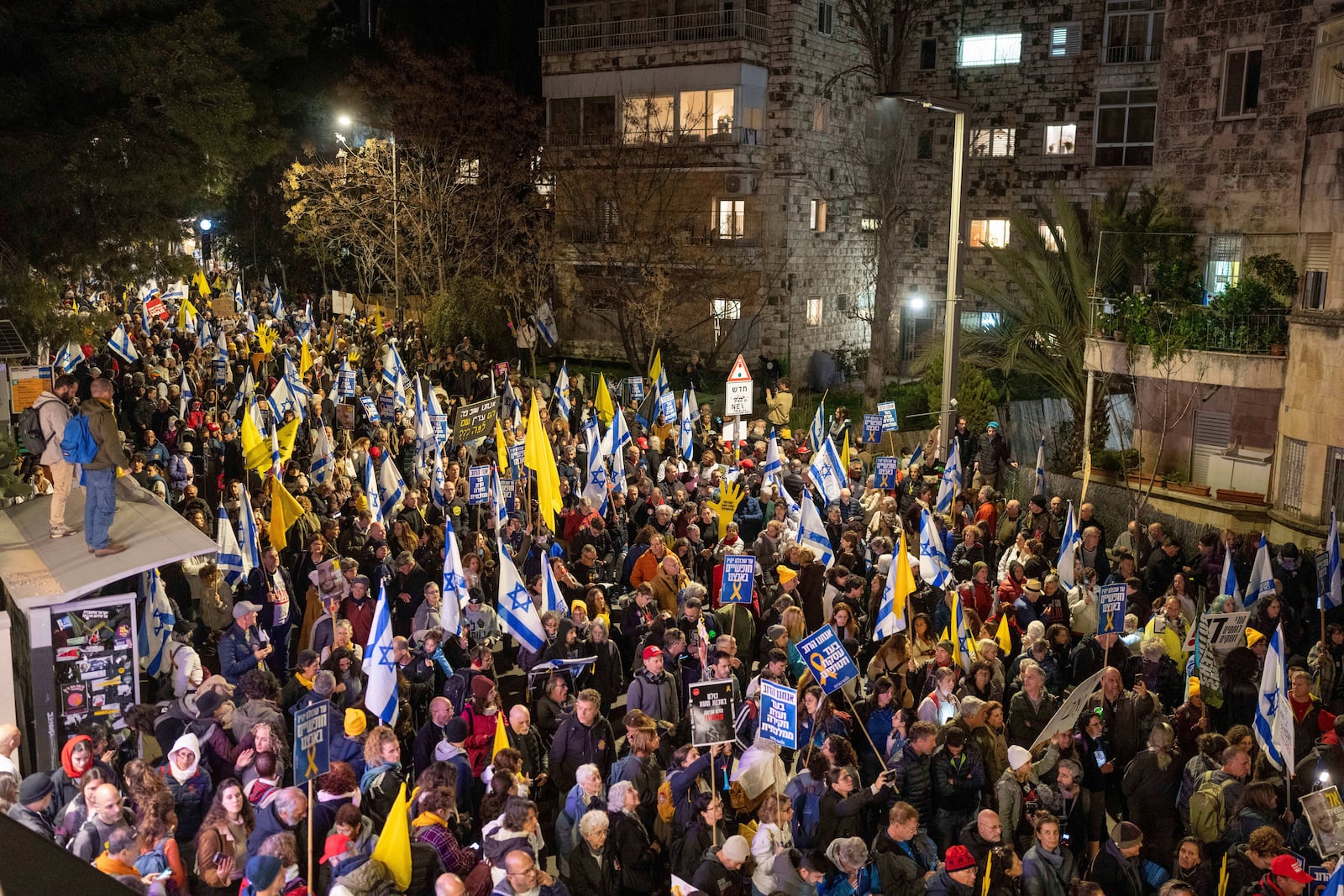 Israelis take part in a protest against Israeli Prime Minister Benjamin Netanyahu's government, and the release of the hostages held in the Gaza Strip by the Hamas militant group, in Jerusalem,Sunday, March 2, 2025. (AP Photo/Ohad Zwigenberg)