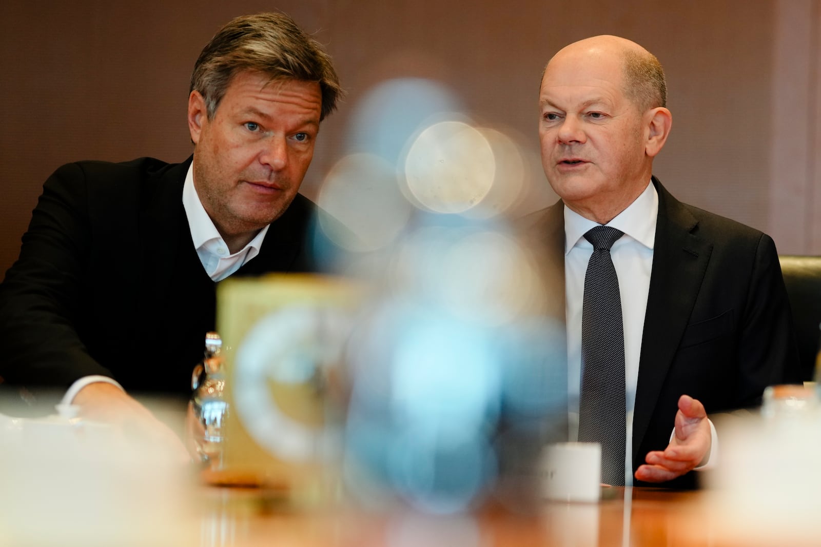 German Chancellor Olaf Scholz, right, speaks with Vice Chancellor and Economy and Climate Minister Robert Habeck, left, during the cabinet meeting at the chancellery in Berlin, Germany, Wednesday, Dec. 11, 2024. (AP Photo/Markus Schreiber)